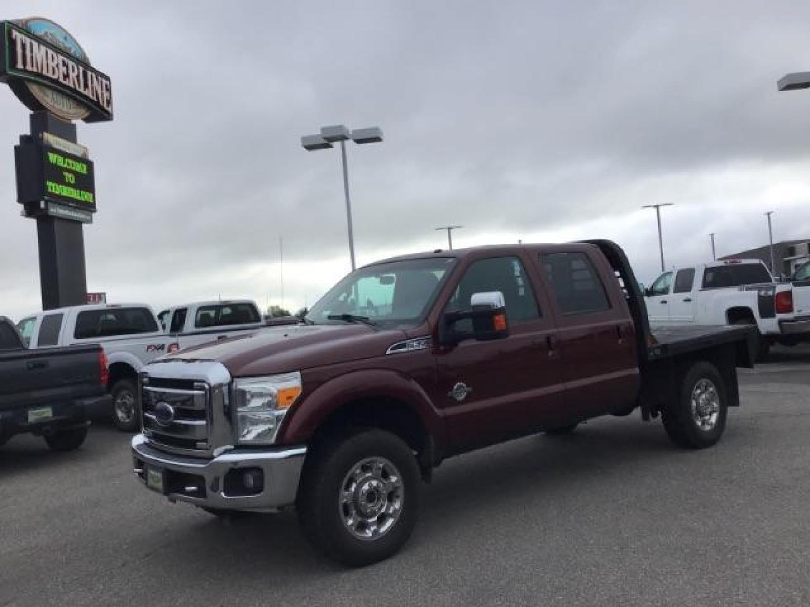 2012 MAROON /Black Leather Interior Ford F-350 SD Lariat Crew Cab 4WD (1FT8W3BTXCE) with an 6.7L V8 OHV 16V DIESEL engine, 6-Speed Automatic transmission, located at 1235 N Woodruff Ave., Idaho Falls, 83401, (208) 523-1053, 43.507172, -112.000488 - This 2012 F350 Lariat, has the 6.7L motor. Only has 103,372 miles. It is a flat bed. It comes with black leather seats, sunroof, navigation, heated and cooled seats,, and the exterior and interior are in great condition. At Timberline Auto it is always easy to find a great deal on your next vehicle - Photo #0