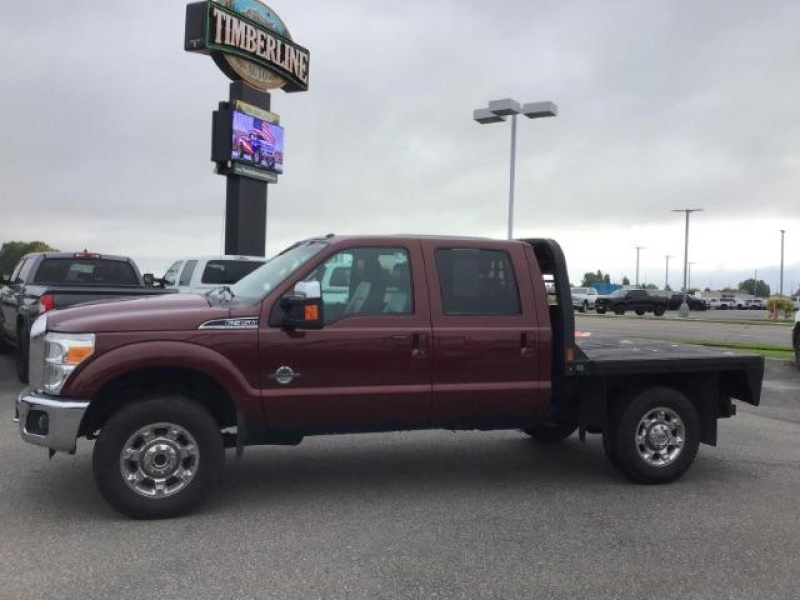 2012 MAROON /Black Leather Interior Ford F-350 SD Lariat Crew Cab 4WD (1FT8W3BTXCE) with an 6.7L V8 OHV 16V DIESEL engine, 6-Speed Automatic transmission, located at 1235 N Woodruff Ave., Idaho Falls, 83401, (208) 523-1053, 43.507172, -112.000488 - This 2012 F350 Lariat, has the 6.7L motor. Only has 103,372 miles. It is a flat bed. It comes with black leather seats, sunroof, navigation, heated and cooled seats,, and the exterior and interior are in great condition. At Timberline Auto it is always easy to find a great deal on your next vehicle - Photo #1