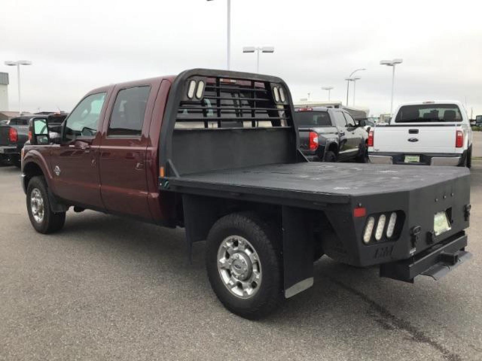 2012 MAROON /Black Leather Interior Ford F-350 SD Lariat Crew Cab 4WD (1FT8W3BTXCE) with an 6.7L V8 OHV 16V DIESEL engine, 6-Speed Automatic transmission, located at 1235 N Woodruff Ave., Idaho Falls, 83401, (208) 523-1053, 43.507172, -112.000488 - This 2012 F350 Lariat, has the 6.7L motor. Only has 103,372 miles. It is a flat bed. It comes with black leather seats, sunroof, navigation, heated and cooled seats,, and the exterior and interior are in great condition. At Timberline Auto it is always easy to find a great deal on your next vehicle - Photo #2