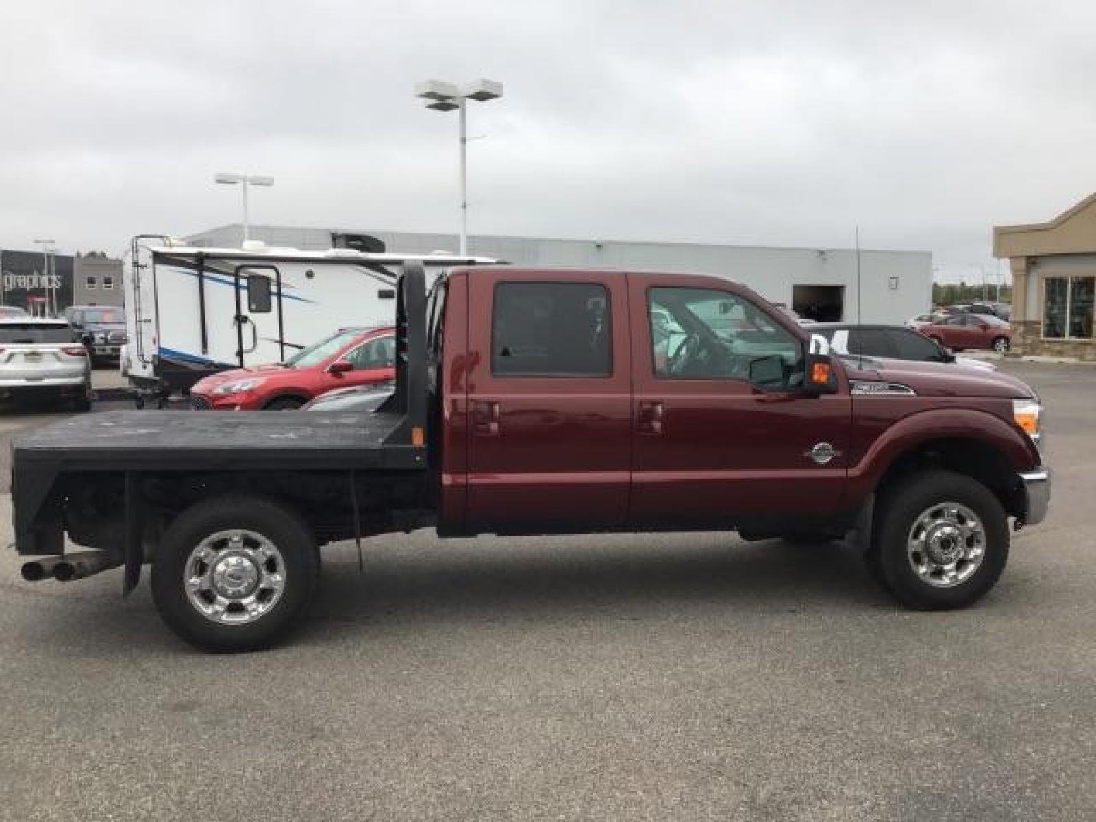 2012 MAROON /Black Leather Interior Ford F-350 SD Lariat Crew Cab 4WD (1FT8W3BTXCE) with an 6.7L V8 OHV 16V DIESEL engine, 6-Speed Automatic transmission, located at 1235 N Woodruff Ave., Idaho Falls, 83401, (208) 523-1053, 43.507172, -112.000488 - This 2012 F350 Lariat, has the 6.7L motor. Only has 103,372 miles. It is a flat bed. It comes with black leather seats, sunroof, navigation, heated and cooled seats,, and the exterior and interior are in great condition. At Timberline Auto it is always easy to find a great deal on your next vehicle - Photo #5