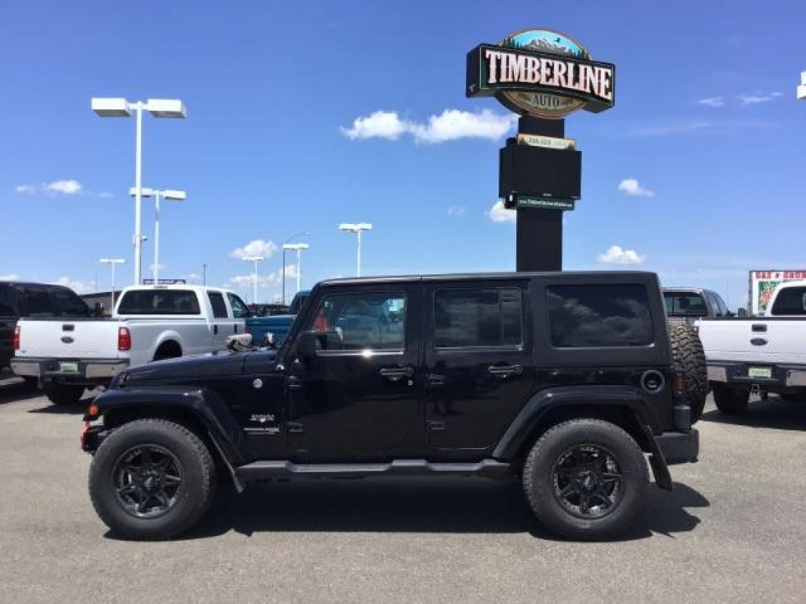2018 Black Clear Coat /Black, cloth Jeep Wrangler JK Unlimited Sahara 4WD (1C4BJWEG8JL) with an 3.6L V6 DOHC 24V FFV engine, 6-Speed Automatic transmission, located at 1235 N Woodruff Ave., Idaho Falls, 83401, (208) 523-1053, 43.507172, -112.000488 - This Jeep is in very good condition and has a few aftermarket parts like the Angry Jeep Face grill replacement, MOTO METAL wheels, light pods, light bars, aftermarket front bumper, head lights, and tail lights. Inside you'll see the clean Sahara premium seats, a large infotainment screen, the ALPINE - Photo #2