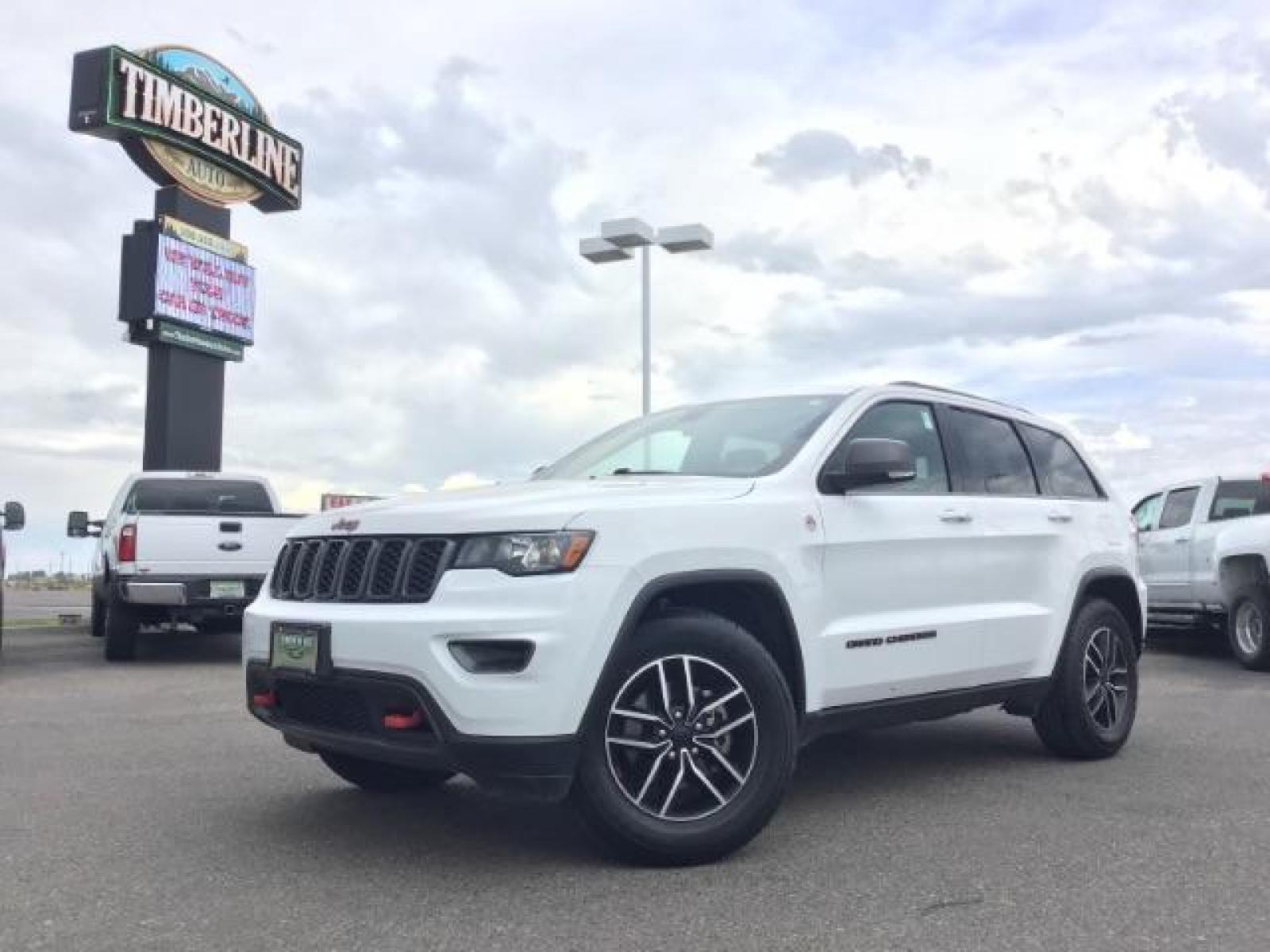 2020 Bright White Clear Coat /Black/Ruby Red, leather Jeep Grand Cherokee Trailhawk 4WD (1C4RJFLG5LC) with an 3.6L V6 DOHC 24V engine, 8-Speed Automatic transmission, located at 1235 N Woodruff Ave., Idaho Falls, 83401, (208) 523-1053, 43.507172, -112.000488 - Leather and loaded, heated and cooled seats, blind spot monitors, AWD, low miles. At Timberline Auto it is always easy to find a great deal on your next vehicle! Our experienced sales staff can help find the right vehicle that will fit your needs. Our knowledgeable finance department has options for - Photo #0