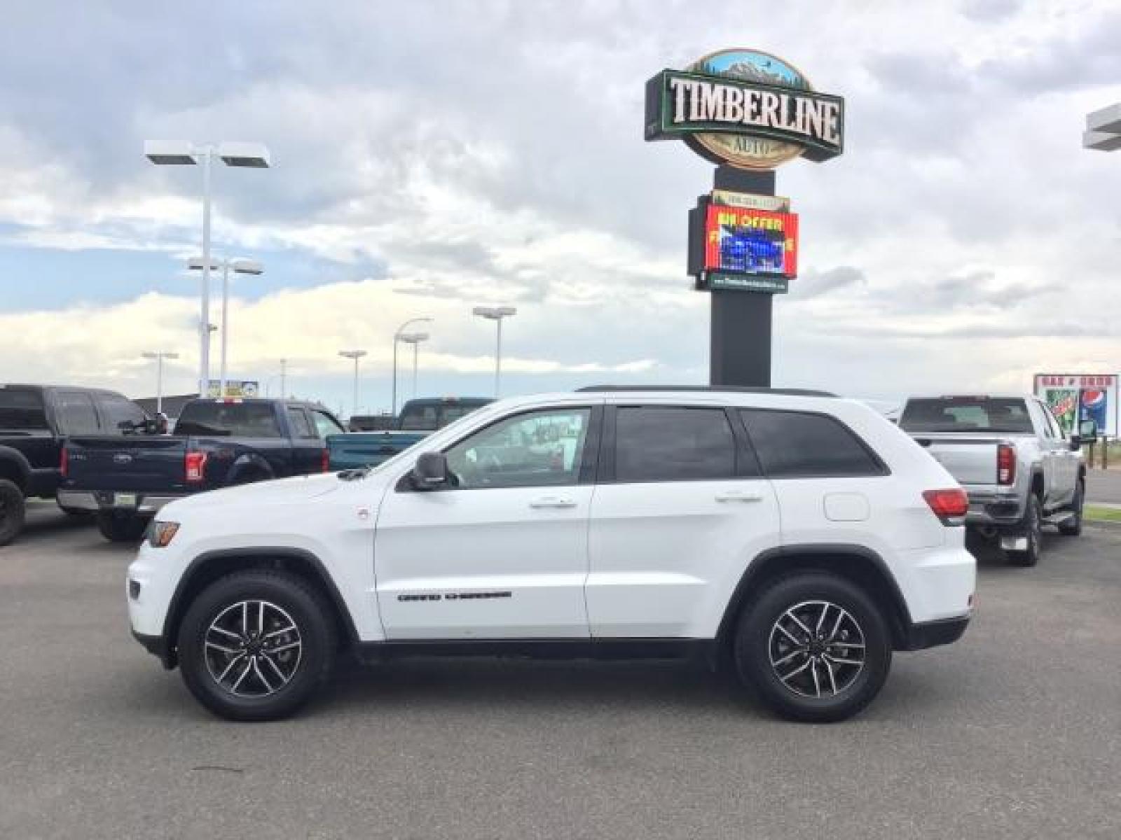 2020 Bright White Clear Coat /Black/Ruby Red, leather Jeep Grand Cherokee Trailhawk 4WD (1C4RJFLG5LC) with an 3.6L V6 DOHC 24V engine, 8-Speed Automatic transmission, located at 1235 N Woodruff Ave., Idaho Falls, 83401, (208) 523-1053, 43.507172, -112.000488 - Leather and loaded, heated and cooled seats, blind spot monitors, AWD, low miles. At Timberline Auto it is always easy to find a great deal on your next vehicle! Our experienced sales staff can help find the right vehicle that will fit your needs. Our knowledgeable finance department has options for - Photo #1