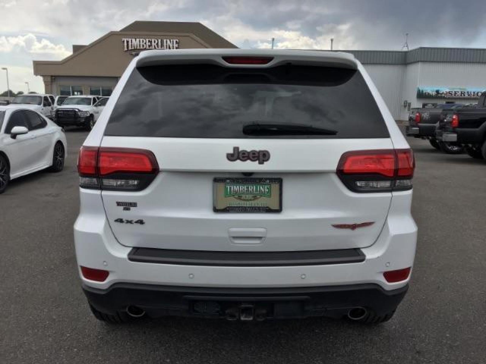 2020 Bright White Clear Coat /Black/Ruby Red, leather Jeep Grand Cherokee Trailhawk 4WD (1C4RJFLG5LC) with an 3.6L V6 DOHC 24V engine, 8-Speed Automatic transmission, located at 1235 N Woodruff Ave., Idaho Falls, 83401, (208) 523-1053, 43.507172, -112.000488 - Leather and loaded, heated and cooled seats, blind spot monitors, AWD, low miles. At Timberline Auto it is always easy to find a great deal on your next vehicle! Our experienced sales staff can help find the right vehicle that will fit your needs. Our knowledgeable finance department has options for - Photo #3
