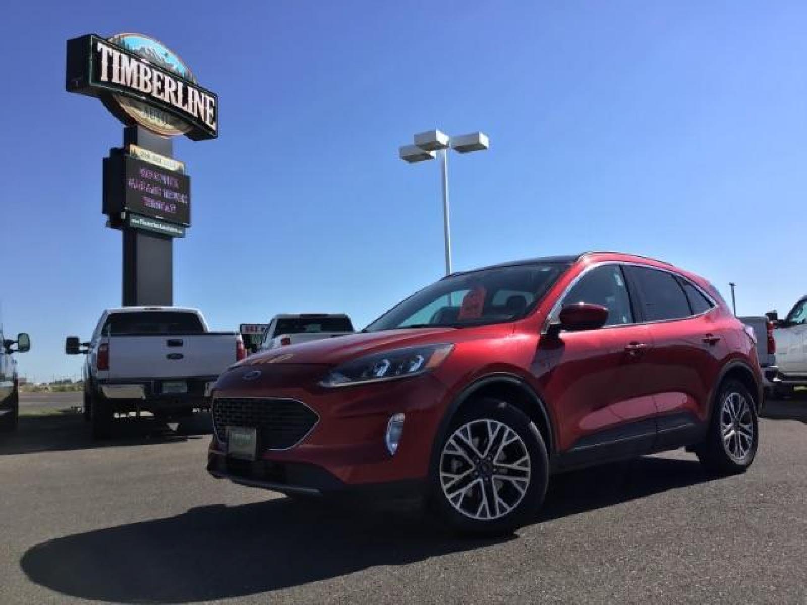 2021 Rapid Red Metallic Tinted Clearcoat /Ebony Ford Escape SEL AWD (1FMCU9H62MU) with an 1.5L L3 engine, 8-Speed Automatic transmission, located at 1235 N Woodruff Ave., Idaho Falls, 83401, (208) 523-1053, 43.507172, -112.000488 - 2021 Ford Escape SEL package with the 1.5L EcoBoost engine, heated seats, remote start, dual moonroof, and so much more! At Timberline Auto it is always easy to find a great deal on your next vehicle! Our experienced sales staff can help find the right vehicle that will fit your needs. Our knowled - Photo #0