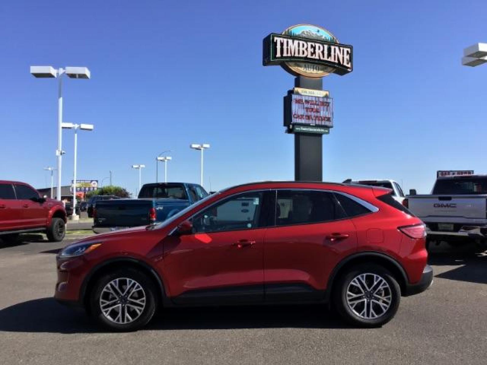 2021 Rapid Red Metallic Tinted Clearcoat /Ebony Ford Escape SEL AWD (1FMCU9H62MU) with an 1.5L L3 engine, 8-Speed Automatic transmission, located at 1235 N Woodruff Ave., Idaho Falls, 83401, (208) 523-1053, 43.507172, -112.000488 - Photo #2