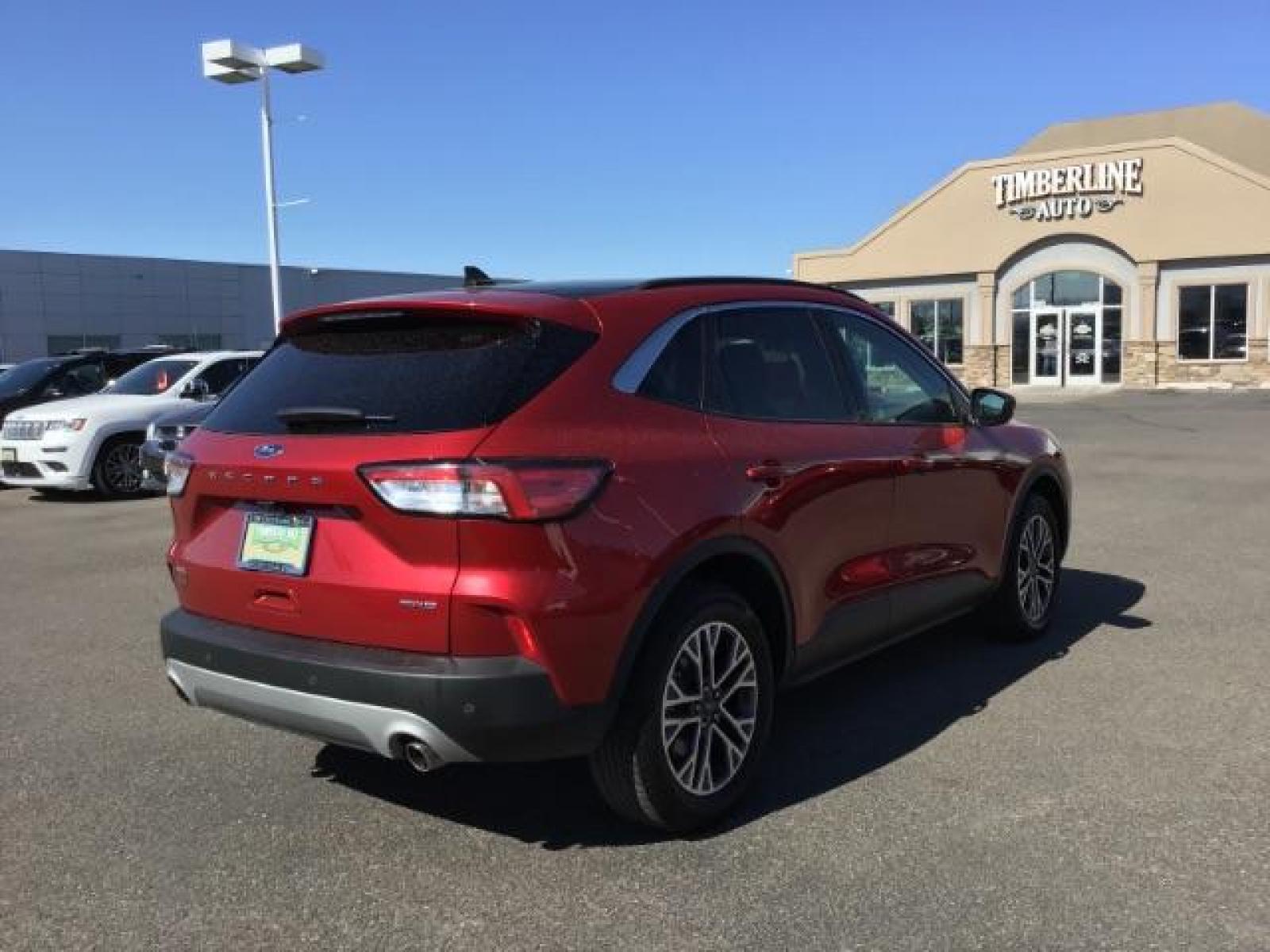 2021 Rapid Red Metallic Tinted Clearcoat /Ebony Ford Escape SEL AWD (1FMCU9H62MU) with an 1.5L L3 engine, 8-Speed Automatic transmission, located at 1235 N Woodruff Ave., Idaho Falls, 83401, (208) 523-1053, 43.507172, -112.000488 - 2021 Ford Escape SEL package with the 1.5L EcoBoost engine, heated seats, remote start, dual moonroof, and so much more! At Timberline Auto it is always easy to find a great deal on your next vehicle! Our experienced sales staff can help find the right vehicle that will fit your needs. Our knowled - Photo #5