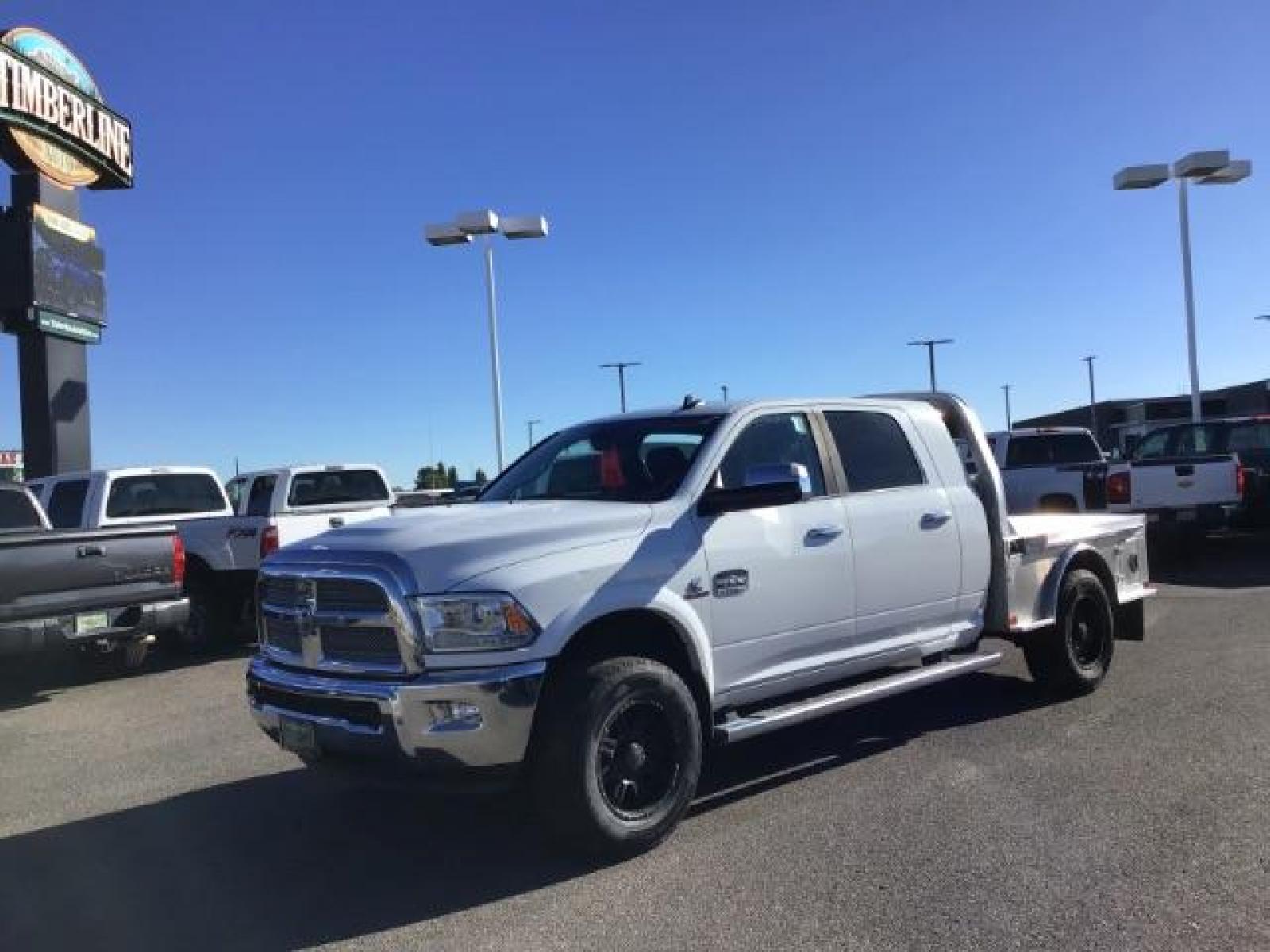 2015 Bright White Clear Coat /LEATHER RAM 2500 Longhorn Mega Cab SWB 4WD (3C6UR5PL9FG) with an 6.7L L6 OHV 24V TURBO DIESEL engine, 6-Speed Automatic transmission, located at 1235 N Woodruff Ave., Idaho Falls, 83401, (208) 523-1053, 43.507172, -112.000488 - This 2015 Ram 2500 Mega Cab Longhorn Edition, has the 6.7L Diesel motor. It has 159,423 miles. It comes with a flat bed, running boards, sunroof, heated and cooled seats, and rear heated seats. At Timberline Auto it is always easy to find a great deal on your next vehicle! Our experienced sales st - Photo #0