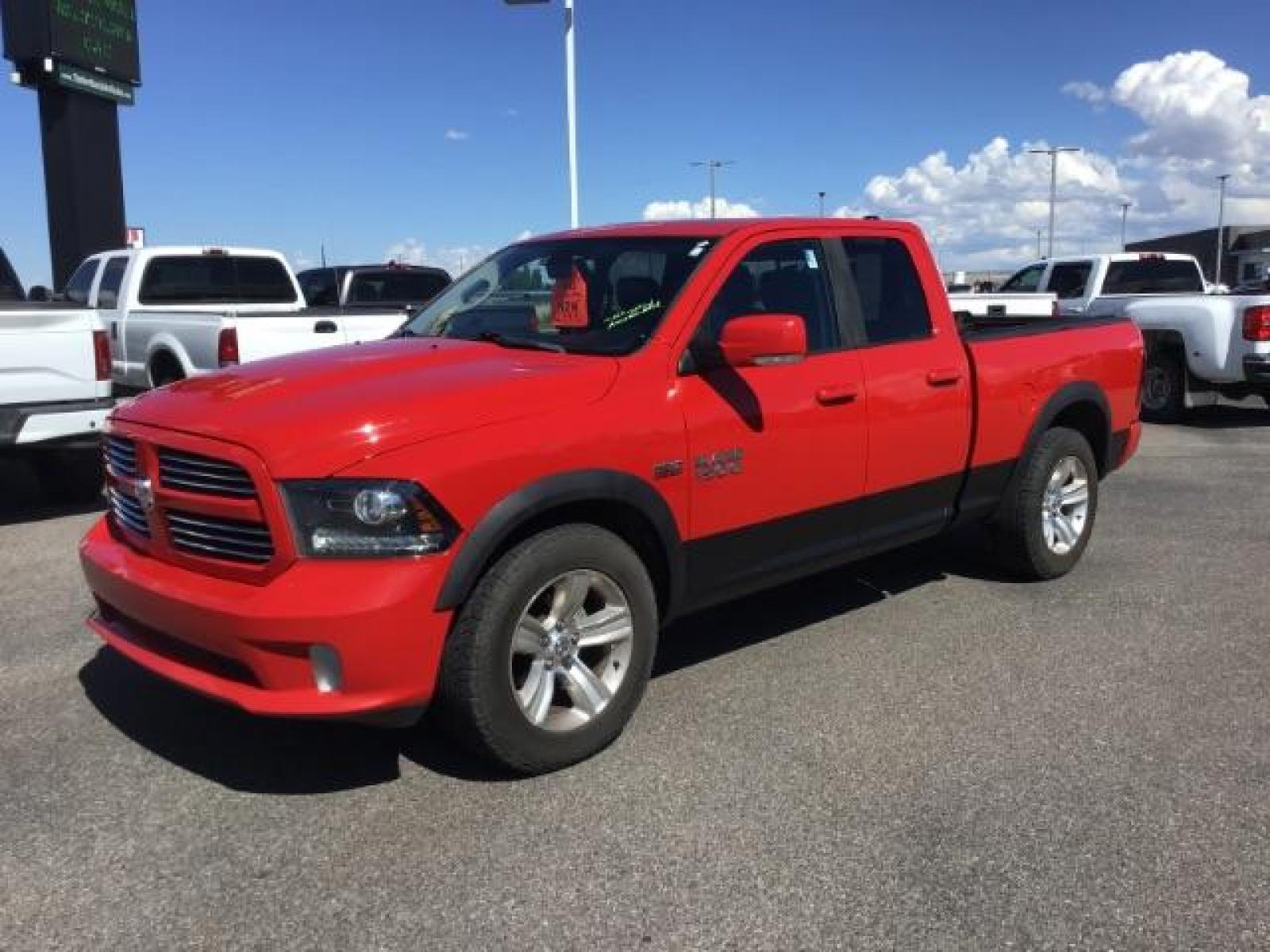 2013 Flame Red /Black Cloth Interior RAM 1500 Sport Quad Cab 4WD (1C6RR7HT4DS) with an 5.7L V8 OHV 16V engine, 6-Speed Automatic transmission, located at 1235 N Woodruff Ave., Idaho Falls, 83401, (208) 523-1053, 43.507172, -112.000488 - Leather, sport package, 4X4, Bluetooth, Alpine Sound System, heated and cooled seats, heated steering wheel, tow package, 6.6' bed, Tonneau cover. At Timberline Auto it is always easy to find a great deal on your next vehicle! Our experienced sales staff can help find the right vehicle that will fi - Photo #0