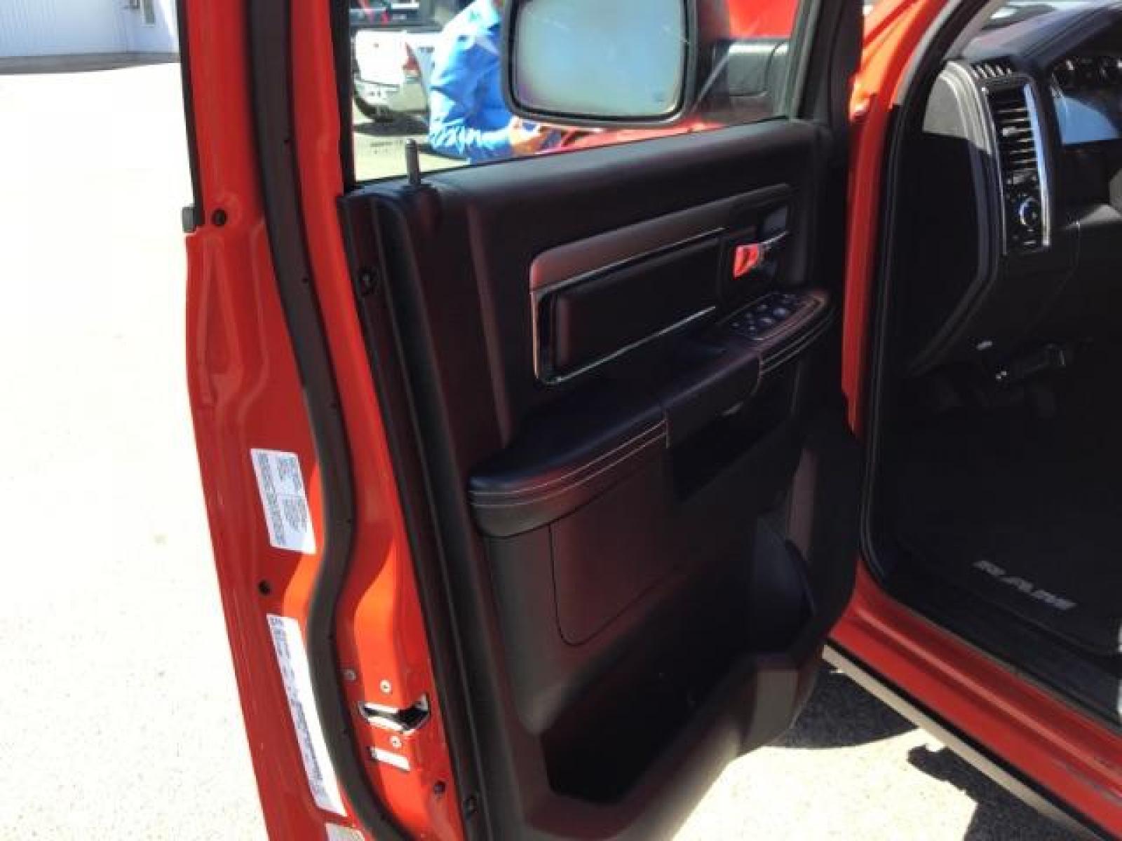 2013 Flame Red /Black Cloth Interior RAM 1500 Sport Quad Cab 4WD (1C6RR7HT4DS) with an 5.7L V8 OHV 16V engine, 6-Speed Automatic transmission, located at 1235 N Woodruff Ave., Idaho Falls, 83401, (208) 523-1053, 43.507172, -112.000488 - Leather, sport package, 4X4, Bluetooth, Alpine Sound System, heated and cooled seats, heated steering wheel, tow package, 6.6' bed, Tonneau cover. At Timberline Auto it is always easy to find a great deal on your next vehicle! Our experienced sales staff can help find the right vehicle that will fi - Photo #12