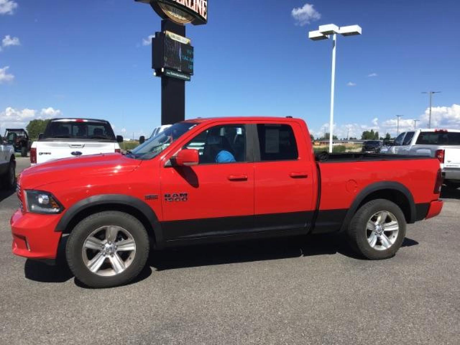 2013 Flame Red /Black Cloth Interior RAM 1500 Sport Quad Cab 4WD (1C6RR7HT4DS) with an 5.7L V8 OHV 16V engine, 6-Speed Automatic transmission, located at 1235 N Woodruff Ave., Idaho Falls, 83401, (208) 523-1053, 43.507172, -112.000488 - Leather, sport package, 4X4, Bluetooth, Alpine Sound System, heated and cooled seats, heated steering wheel, tow package, 6.6' bed, Tonneau cover. At Timberline Auto it is always easy to find a great deal on your next vehicle! Our experienced sales staff can help find the right vehicle that will fi - Photo #1