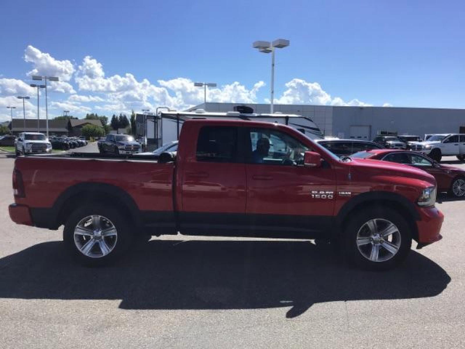 2013 Flame Red /Black Cloth Interior RAM 1500 Sport Quad Cab 4WD (1C6RR7HT4DS) with an 5.7L V8 OHV 16V engine, 6-Speed Automatic transmission, located at 1235 N Woodruff Ave., Idaho Falls, 83401, (208) 523-1053, 43.507172, -112.000488 - Leather, sport package, 4X4, Bluetooth, Alpine Sound System, heated and cooled seats, heated steering wheel, tow package, 6.6' bed, Tonneau cover. At Timberline Auto it is always easy to find a great deal on your next vehicle! Our experienced sales staff can help find the right vehicle that will fi - Photo #5