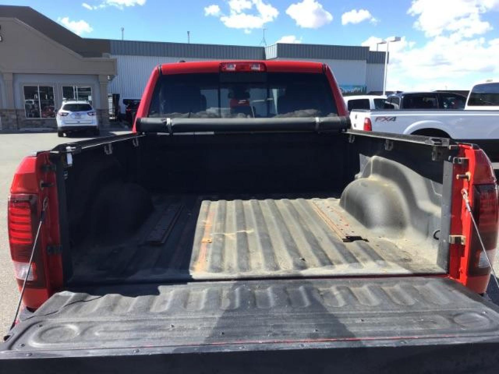 2013 Flame Red /Black Cloth Interior RAM 1500 Sport Quad Cab 4WD (1C6RR7HT4DS) with an 5.7L V8 OHV 16V engine, 6-Speed Automatic transmission, located at 1235 N Woodruff Ave., Idaho Falls, 83401, (208) 523-1053, 43.507172, -112.000488 - Leather, sport package, 4X4, Bluetooth, Alpine Sound System, heated and cooled seats, heated steering wheel, tow package, 6.6' bed, Tonneau cover. At Timberline Auto it is always easy to find a great deal on your next vehicle! Our experienced sales staff can help find the right vehicle that will fi - Photo #7