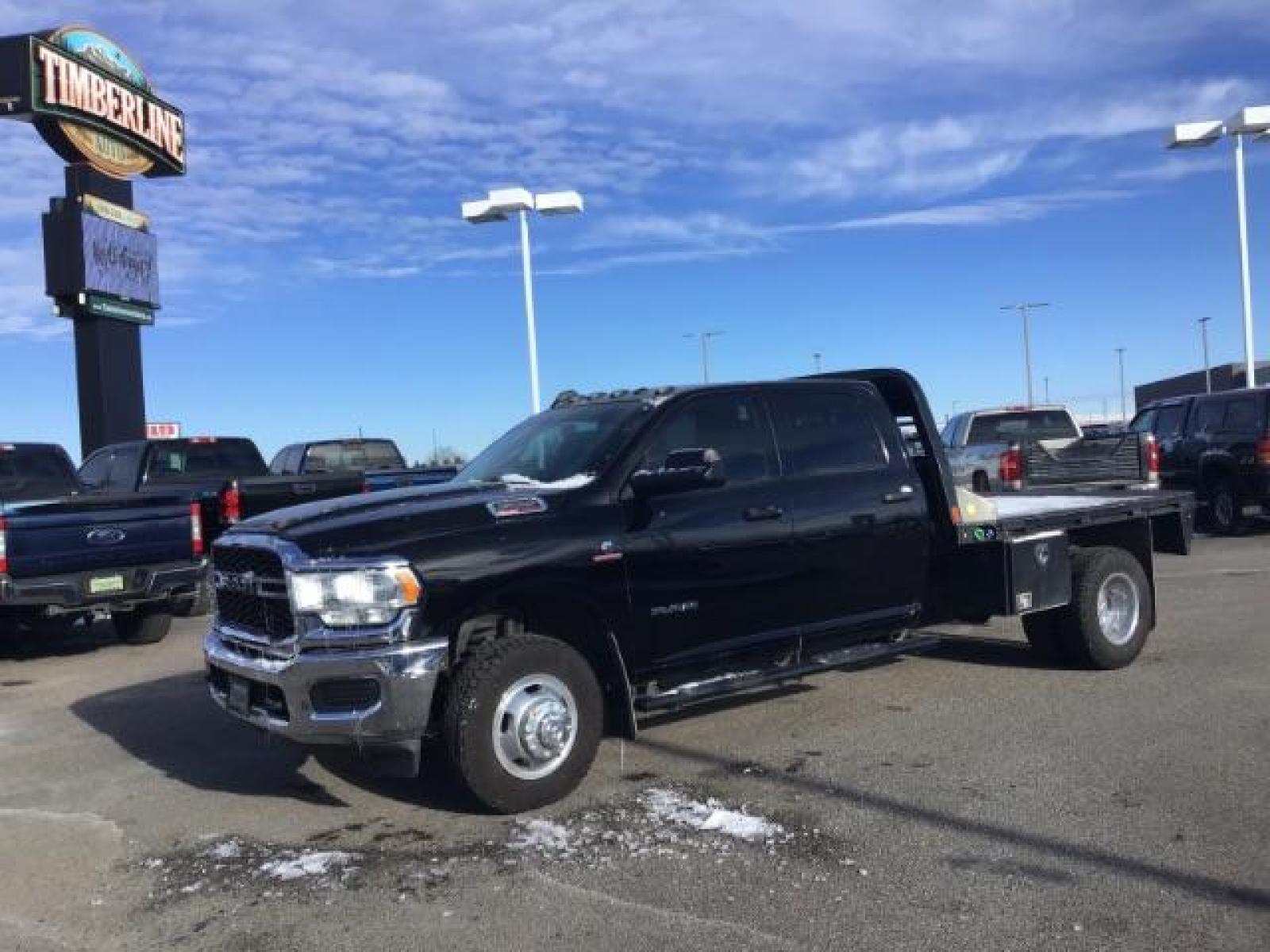 2020 BLACK /CLOTH RAM 3500 Tradesman Crew Cab 4WD DRW (3C63RRGL3LG) with an 6.7L L6 OHV 24V TURBO DIESEL engine, 6-Speed Automatic transmission, located at 1235 N Woodruff Ave., Idaho Falls, 83401, (208) 523-1053, 43.507172, -112.000488 - this 2020 Ram 3500 SLT, has a 6.7L Diesel motor. It has 105,000 miles. It comes with a flatbed with turnover ball. Comes with cloth interior, blue tooth audio, power door locks, power windows and integrated brake control. At Timberline Auto it is always easy to find a great deal on your next vehicle - Photo #0
