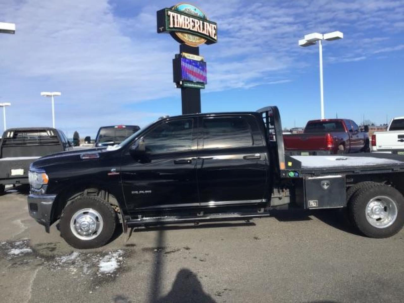 2020 BLACK /CLOTH RAM 3500 Tradesman Crew Cab 4WD DRW (3C63RRGL3LG) with an 6.7L L6 OHV 24V TURBO DIESEL engine, 6-Speed Automatic transmission, located at 1235 N Woodruff Ave., Idaho Falls, 83401, (208) 523-1053, 43.507172, -112.000488 - this 2020 Ram 3500 SLT, has a 6.7L Diesel motor. It has 105,000 miles. It comes with a flatbed with turnover ball. Comes with cloth interior, blue tooth audio, power door locks, power windows and integrated brake control. At Timberline Auto it is always easy to find a great deal on your next vehicle - Photo #1