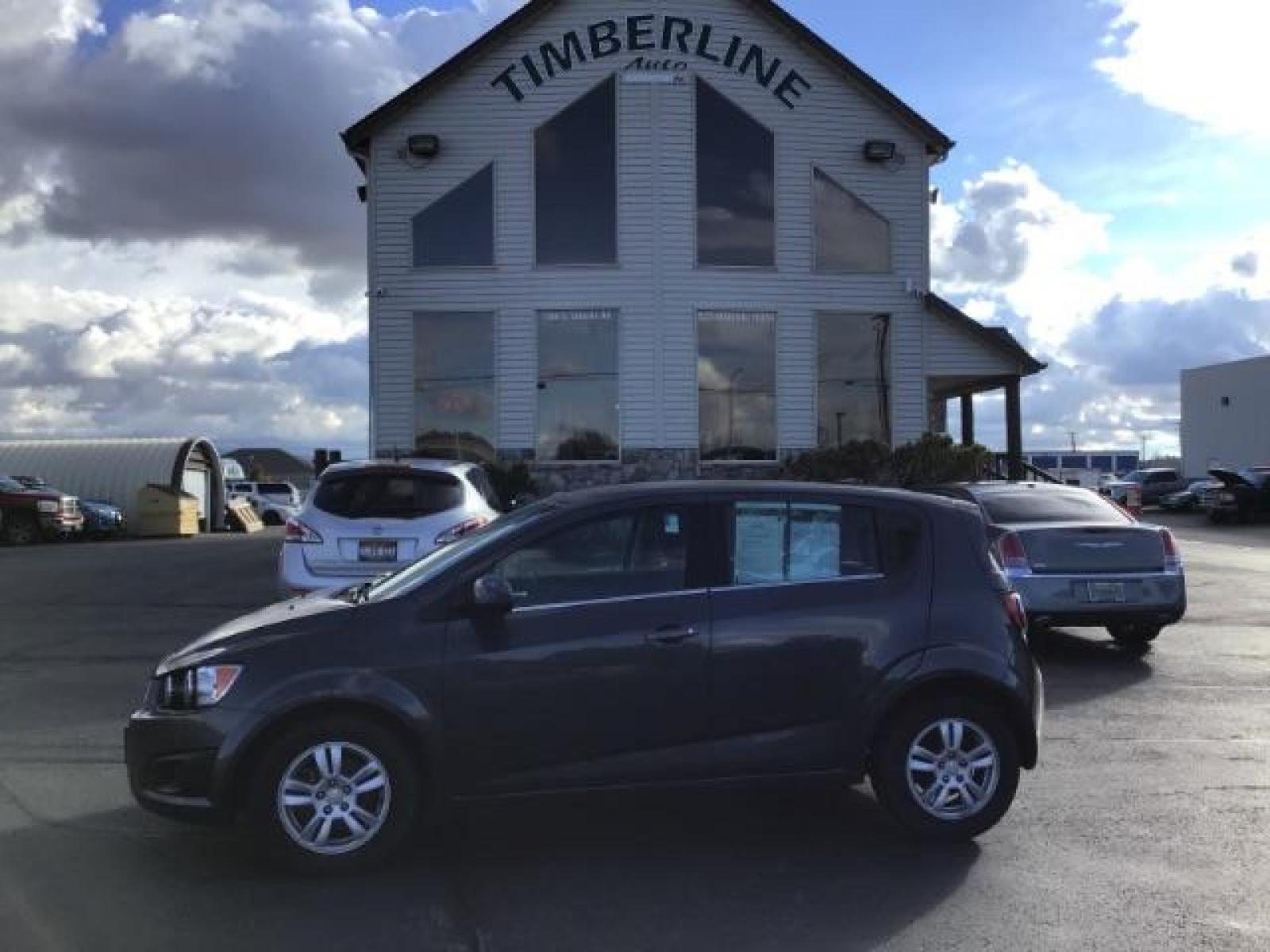 2013 Black Granite Metallic Chevrolet Sonic LT Auto 5-Door (1G1JC6SG7D4) with an 1.8L L4 DOHC 24V engine, 6-Speed Automatic transmission, located at 1235 N Woodruff Ave., Idaho Falls, 83401, (208) 523-1053, 43.507172, -112.000488 - This 2013 Chevrolet Sonic, has the 4 cylinder motor. It has 95,000 miles. It comes with Steering wheel audio controls, cruise control, bluetooth audio, and CD player. At Timberline Auto it is always easy to find a great deal on your next vehicle! Our experienced sales staff can help find the right v - Photo #1