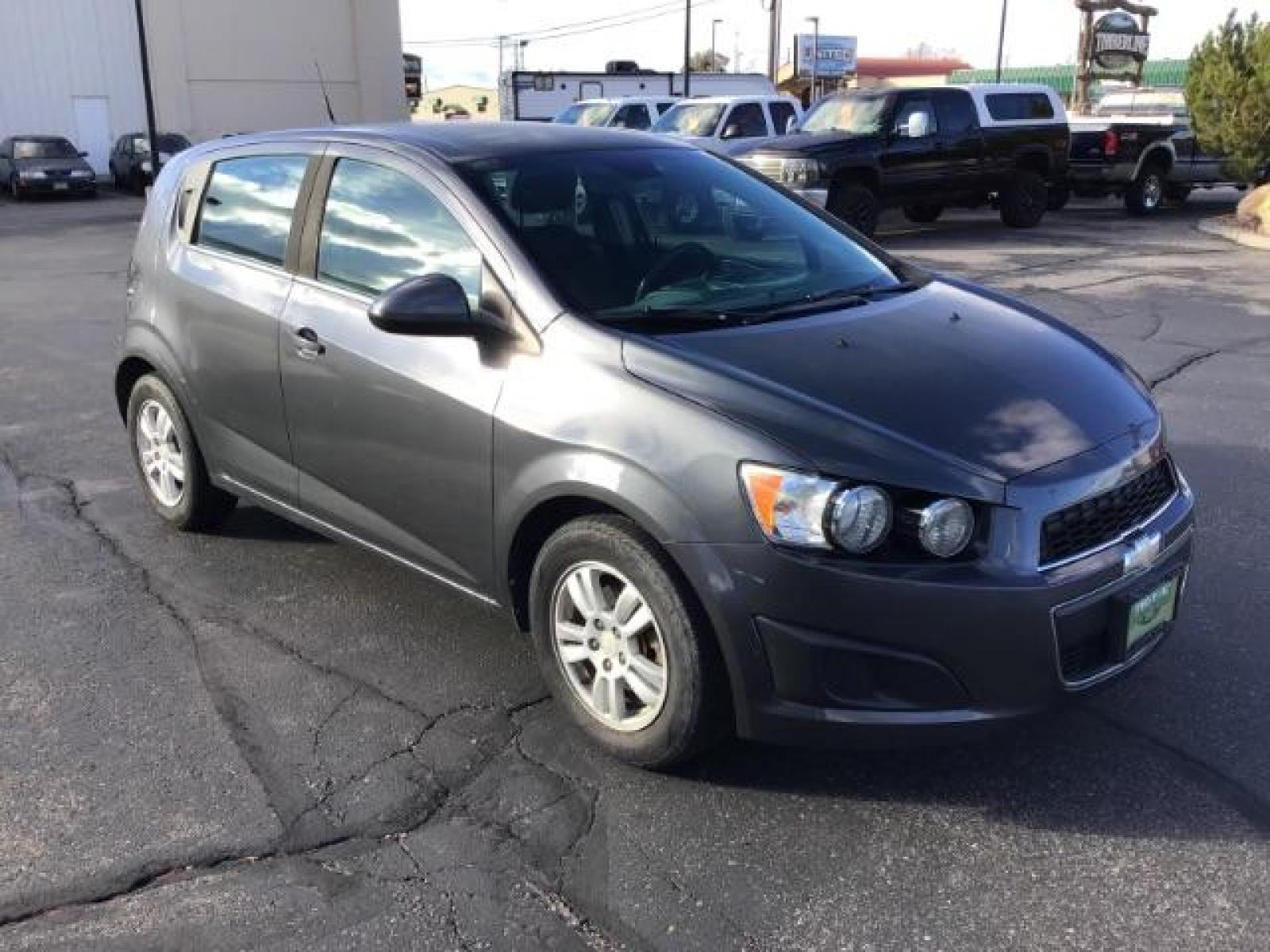 2013 Black Granite Metallic Chevrolet Sonic LT Auto 5-Door (1G1JC6SG7D4) with an 1.8L L4 DOHC 24V engine, 6-Speed Automatic transmission, located at 1235 N Woodruff Ave., Idaho Falls, 83401, (208) 523-1053, 43.507172, -112.000488 - This 2013 Chevrolet Sonic, has the 4 cylinder motor. It has 95,000 miles. It comes with Steering wheel audio controls, cruise control, bluetooth audio, and CD player. At Timberline Auto it is always easy to find a great deal on your next vehicle! Our experienced sales staff can help find the right v - Photo #6