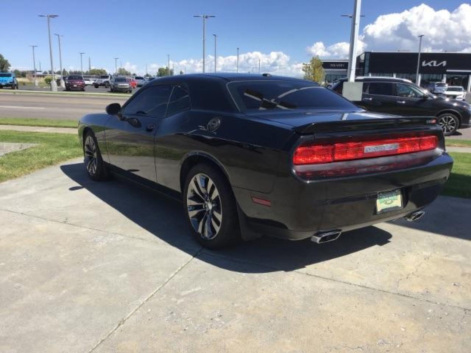 2014 Black Clearcoat /Radar Red/Dk Slate Gray Dodge Challenger SRT8 (2C3CDYCJ5EH) with an 6.4L V8 OHV 16V engine, 5-Speed Automatic transmission, located at 1235 N Woodruff Ave., Idaho Falls, 83401, (208) 523-1053, 43.507172, -112.000488 - Photo #2