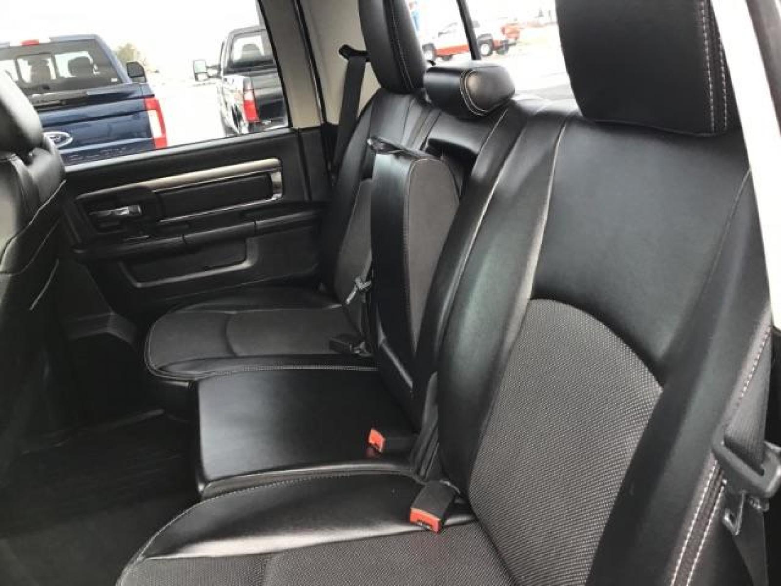 2014 Bright White Clearcoat /Black RAM 1500 Sport Crew Cab LWB 4WD (1C6RR7UT5ES) with an 5.7L V8 OHV 16V engine, 8-Speed Automatic transmission, located at 1235 N Woodruff Ave., Idaho Falls, 83401, (208) 523-1053, 43.507172, -112.000488 - This 2014 Ram 1500 Sport 4x4, has the 5.7L Hemi motor. It has 115,000 miles. Comes with leather interior, heated and cooled seats, power seats, blue tooth audio, back up camera, and power windows and locks. At Timberline Auto it is always easy to find a great deal on your next vehicle! Our experienc - Photo #18