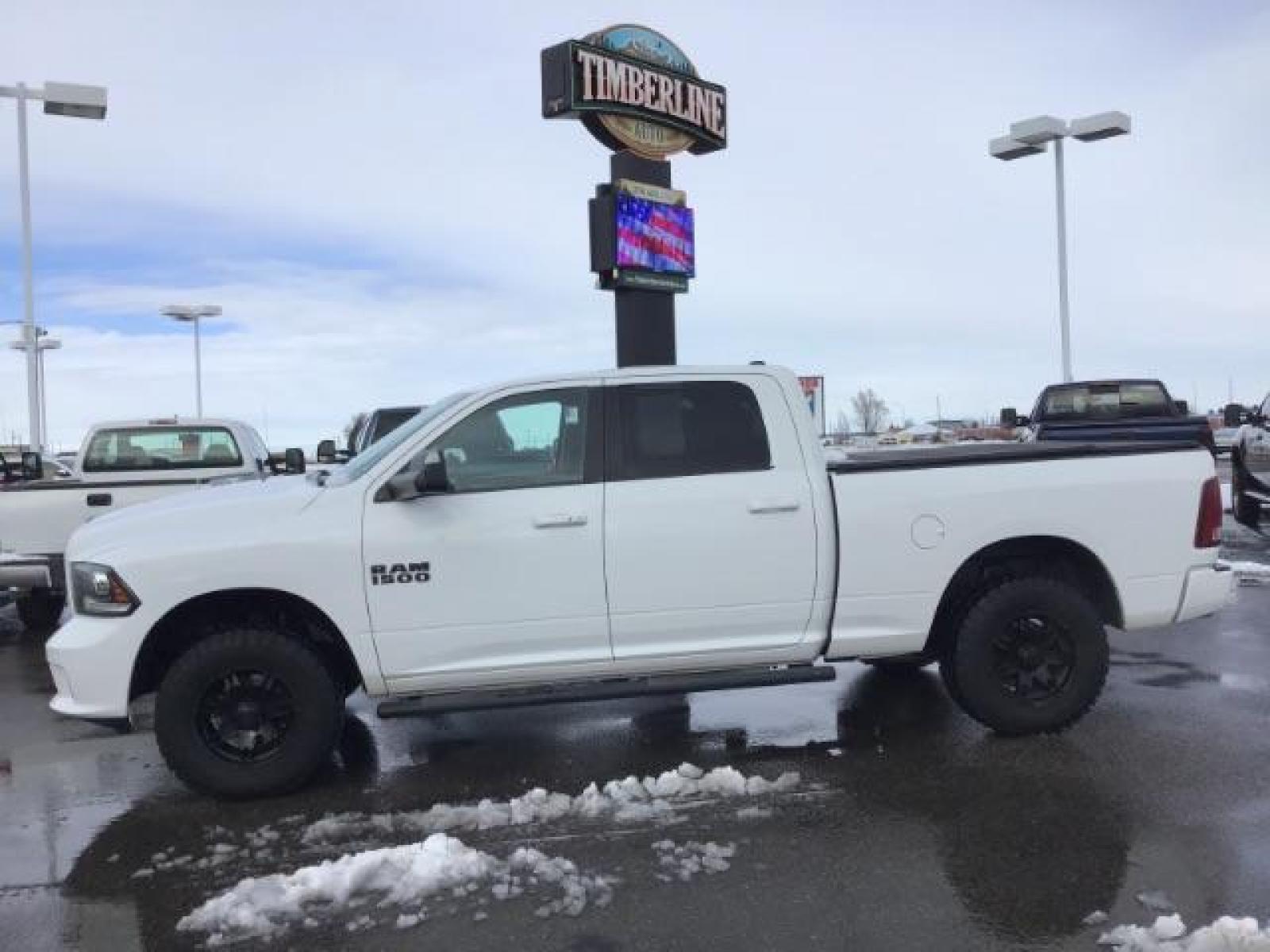 2014 Bright White Clearcoat /Black RAM 1500 Sport Crew Cab LWB 4WD (1C6RR7UT5ES) with an 5.7L V8 OHV 16V engine, 8-Speed Automatic transmission, located at 1235 N Woodruff Ave., Idaho Falls, 83401, (208) 523-1053, 43.507172, -112.000488 - This 2014 Ram 1500 Sport 4x4, has the 5.7L Hemi motor. It has 115,000 miles. Comes with leather interior, heated and cooled seats, power seats, blue tooth audio, back up camera, and power windows and locks. At Timberline Auto it is always easy to find a great deal on your next vehicle! Our experienc - Photo #1