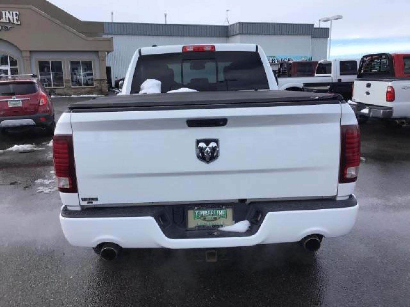 2014 Bright White Clearcoat /Black RAM 1500 Sport Crew Cab LWB 4WD (1C6RR7UT5ES) with an 5.7L V8 OHV 16V engine, 8-Speed Automatic transmission, located at 1235 N Woodruff Ave., Idaho Falls, 83401, (208) 523-1053, 43.507172, -112.000488 - This 2014 Ram 1500 Sport 4x4, has the 5.7L Hemi motor. It has 115,000 miles. Comes with leather interior, heated and cooled seats, power seats, blue tooth audio, back up camera, and power windows and locks. At Timberline Auto it is always easy to find a great deal on your next vehicle! Our experienc - Photo #3