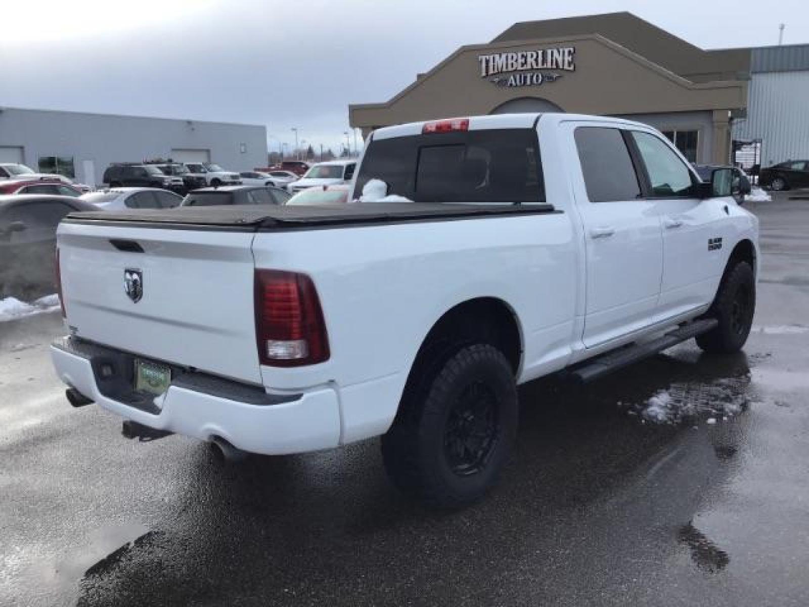 2014 Bright White Clearcoat /Black RAM 1500 Sport Crew Cab LWB 4WD (1C6RR7UT5ES) with an 5.7L V8 OHV 16V engine, 8-Speed Automatic transmission, located at 1235 N Woodruff Ave., Idaho Falls, 83401, (208) 523-1053, 43.507172, -112.000488 - This 2014 Ram 1500 Sport 4x4, has the 5.7L Hemi motor. It has 115,000 miles. Comes with leather interior, heated and cooled seats, power seats, blue tooth audio, back up camera, and power windows and locks. At Timberline Auto it is always easy to find a great deal on your next vehicle! Our experienc - Photo #4