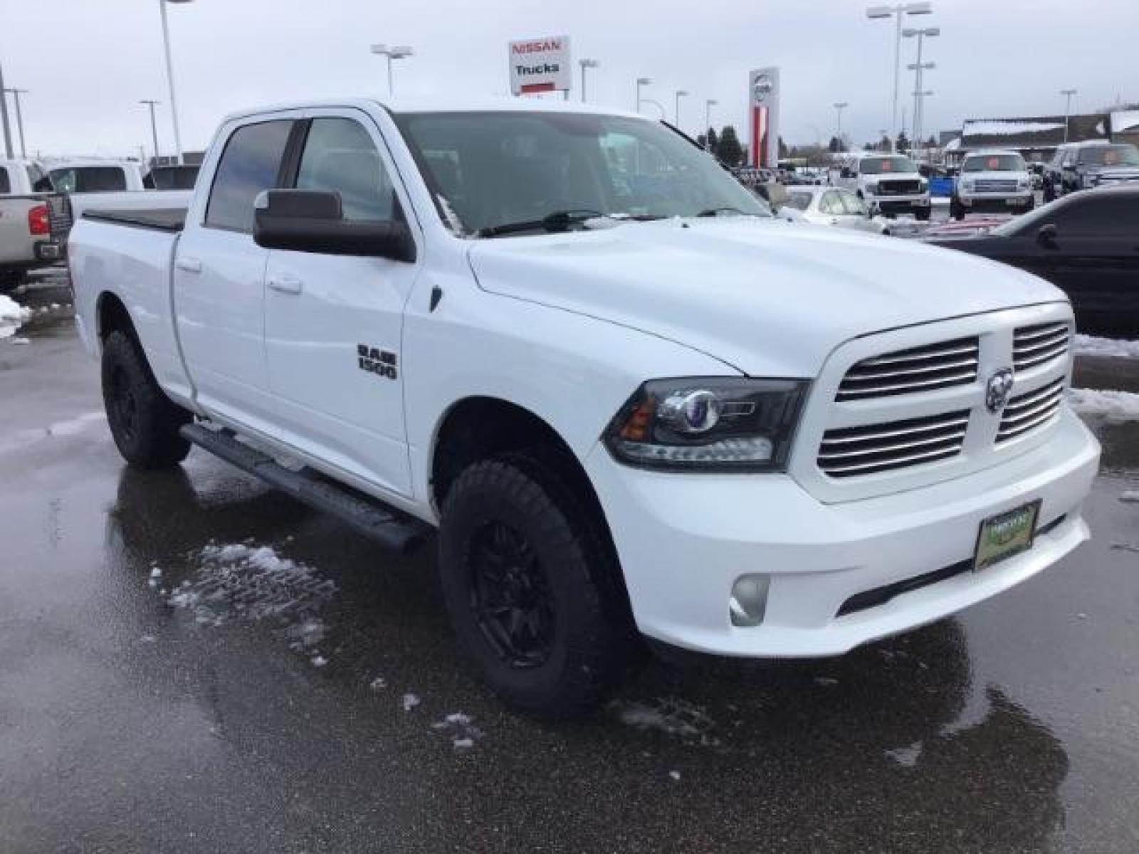 2014 Bright White Clearcoat /Black RAM 1500 Sport Crew Cab LWB 4WD (1C6RR7UT5ES) with an 5.7L V8 OHV 16V engine, 8-Speed Automatic transmission, located at 1235 N Woodruff Ave., Idaho Falls, 83401, (208) 523-1053, 43.507172, -112.000488 - This 2014 Ram 1500 Sport 4x4, has the 5.7L Hemi motor. It has 115,000 miles. Comes with leather interior, heated and cooled seats, power seats, blue tooth audio, back up camera, and power windows and locks. At Timberline Auto it is always easy to find a great deal on your next vehicle! Our experienc - Photo #6