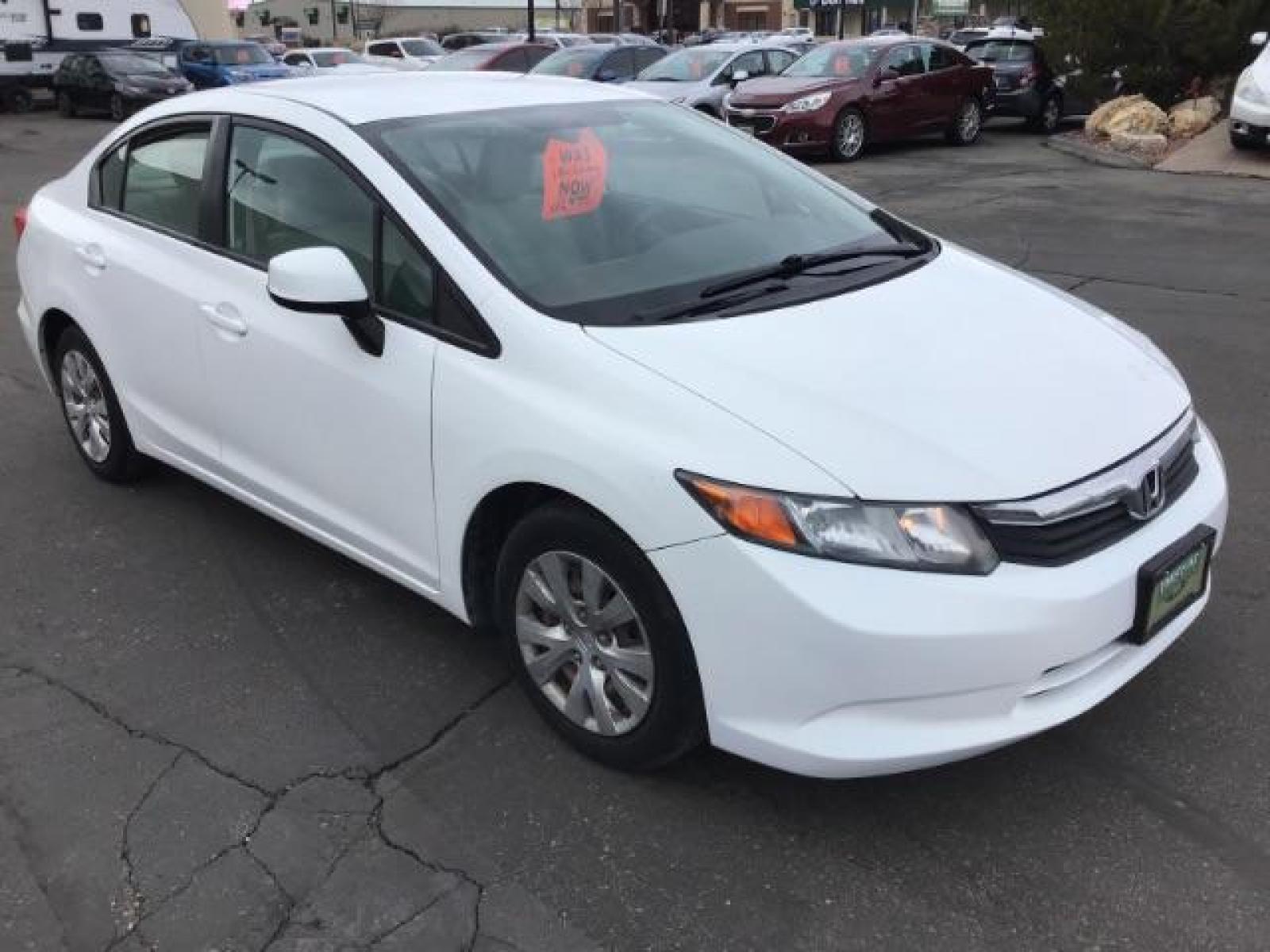 2012 Taffeta White /Gray Cloth Interior Honda Civic LX Sedan 5-Speed AT (19XFB2F54CE) with an 1.8L L4 SOHC 16V engine, 5-Speed Automatic transmission, located at 1235 N Woodruff Ave., Idaho Falls, 83401, (208) 523-1053, 43.507172, -112.000488 - This 2012 Honda Civic LX, has 98,000 miles. Comes with cloth interior, cruise control, power windows and locks, and AM/FM CD stereo. At Timberline Auto it is always easy to find a great deal on your next vehicle! Our experienced sales staff can help find the right vehicle will fit your needs. Our kn - Photo #6