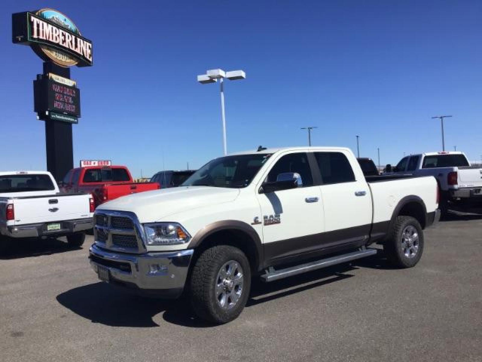 2017 WHITE /Black, leather RAM 3500 Laramie Crew Cab SWB 4WD (3C63R3EL0HG) with an 6.7L L6 OHV 24V TURBO DIESEL engine, 6-Speed Automatic transmission, located at 1235 N Woodruff Ave., Idaho Falls, 83401, (208) 523-1053, 43.507172, -112.000488 - This 2017 Ram 3500 Laramie 4x4, has the 6.7L cummins motor. It has 116,000 miles. Comes with leather interior, heated and cooled seats, dual power seats, navigation, back up camera, spray in bedliner, and blue tooth audio. At Timberline Auto it is always easy to find a great deal on your next vehicl - Photo #0
