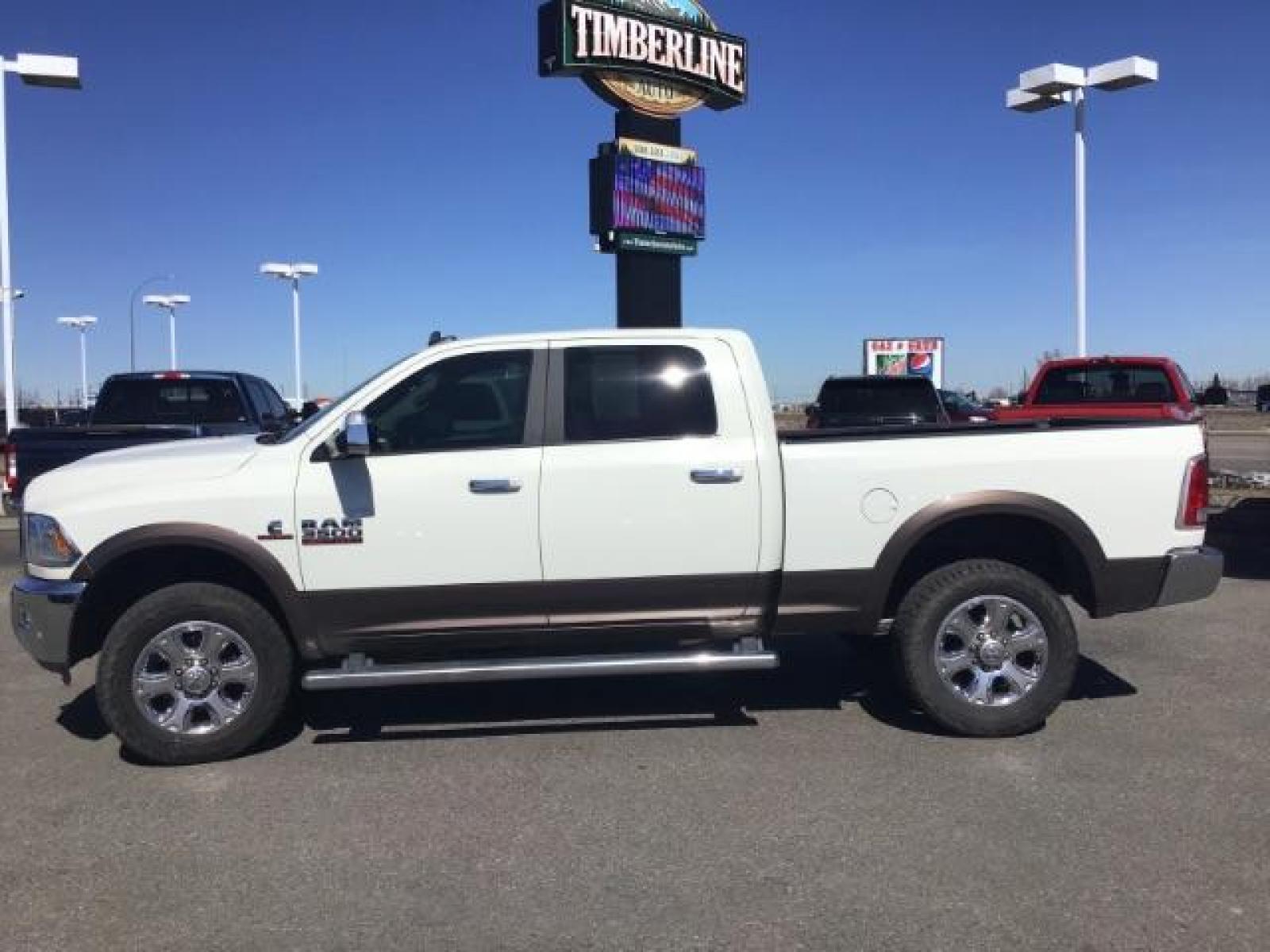 2017 WHITE /Black, leather RAM 3500 Laramie Crew Cab SWB 4WD (3C63R3EL0HG) with an 6.7L L6 OHV 24V TURBO DIESEL engine, 6-Speed Automatic transmission, located at 1235 N Woodruff Ave., Idaho Falls, 83401, (208) 523-1053, 43.507172, -112.000488 - This 2017 Ram 3500 Laramie 4x4, has the 6.7L cummins motor. It has 116,000 miles. Comes with leather interior, heated and cooled seats, dual power seats, navigation, back up camera, spray in bedliner, and blue tooth audio. At Timberline Auto it is always easy to find a great deal on your next vehicl - Photo #1