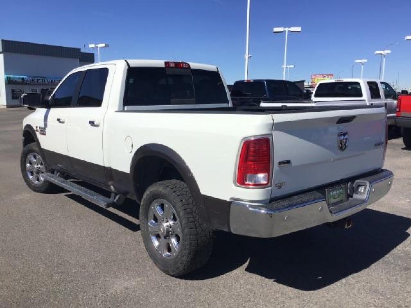 2017 WHITE /Black, leather RAM 3500 Laramie Crew Cab SWB 4WD (3C63R3EL0HG) with an 6.7L L6 OHV 24V TURBO DIESEL engine, 6-Speed Automatic transmission, located at 1235 N Woodruff Ave., Idaho Falls, 83401, (208) 523-1053, 43.507172, -112.000488 - This 2017 Ram 3500 Laramie 4x4, has the 6.7L cummins motor. It has 116,000 miles. Comes with leather interior, heated and cooled seats, dual power seats, navigation, back up camera, spray in bedliner, and blue tooth audio. At Timberline Auto it is always easy to find a great deal on your next vehicl - Photo #2