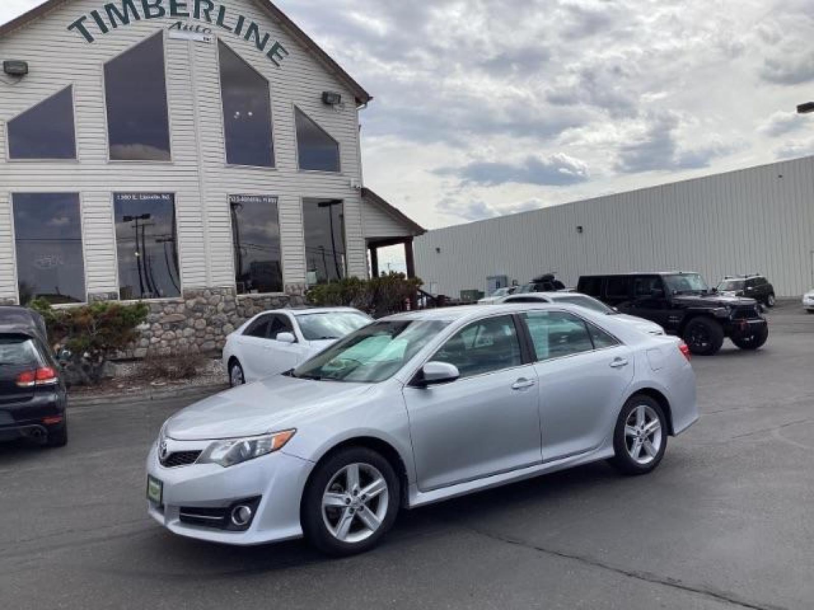 2014 Classic Silver Metallic /Black/Ash 2-Tone Toyota Camry SE (4T1BF1FK9EU) with an 2.5L L4 DOHC 16V engine, 6-Speed Automatic transmission, located at 1235 N Woodruff Ave., Idaho Falls, 83401, (208) 523-1053, 43.507172, -112.000488 - The 2014 Toyota Camry SE is a midsize sedan known for its reliability, comfort, and sporty design. Here are the key features you might find on the 2014 Toyota Camry SE: Engine: Typically equipped with a 2.5-liter inline-four engine producing around 178 horsepower and 170 lb-ft of torque, paired wit - Photo #0