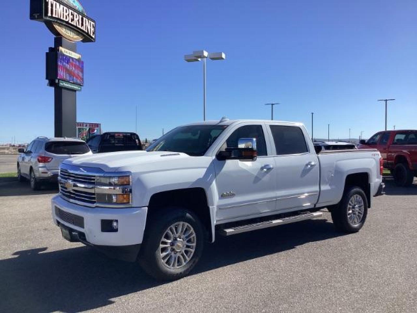 2015 Summit White /Jet Black Chevrolet Silverado 2500HD LT Crew Cab 4WD (1GC1KXE81FF) with an 6.6L V8 OHV 32V TURBO DIESEL engine, 6-Speed Automatic transmission, located at 1235 N Woodruff Ave., Idaho Falls, 83401, (208) 523-1053, 43.507172, -112.000488 - The 2015 Chevrolet Silverado 2500HD High Country Diesel is a top-of-the-line trim level of the Silverado heavy-duty pickup truck, offering a blend of luxury, capability, and advanced technology. Here are some key features you might find on the 2015 Chevrolet Silverado 2500HD High Country Diesel: Dur - Photo #0