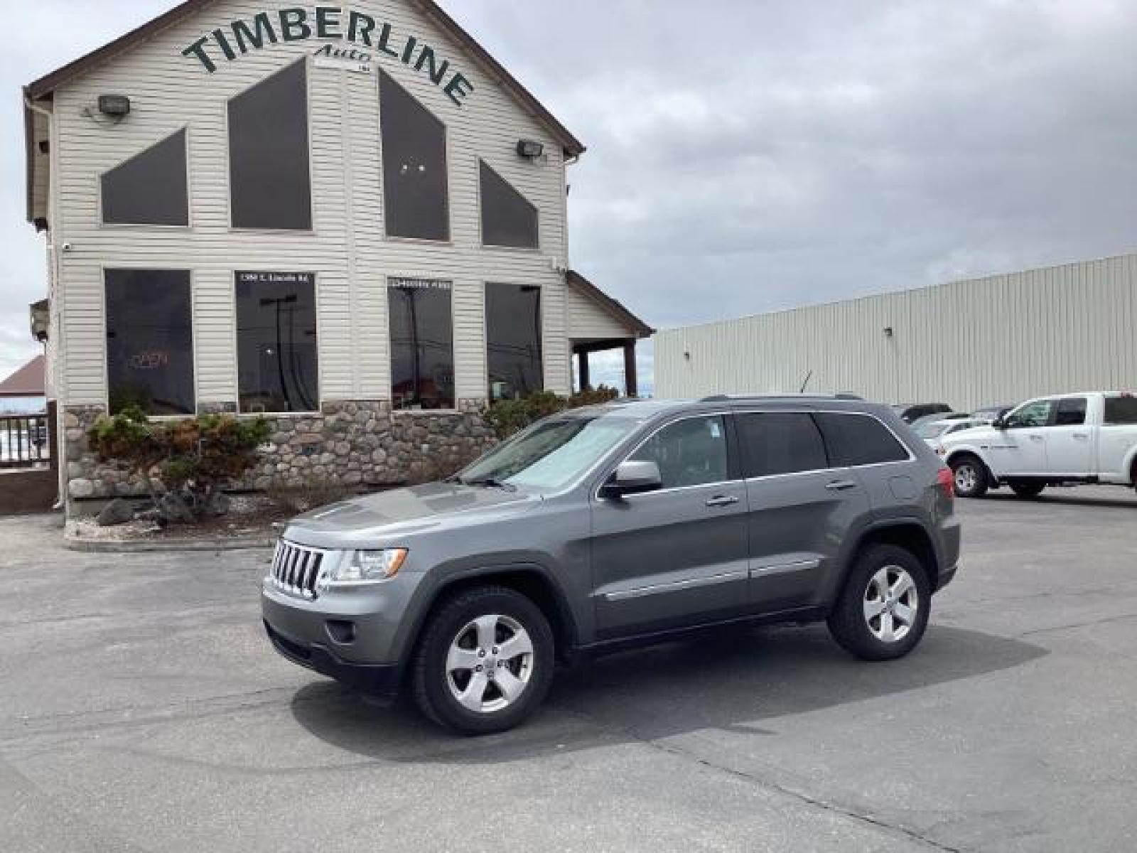 2012 Mineral Gray Metallic Jeep Grand Cherokee Laredo 4WD (1C4RJFAG3CC) with an 3.6L V6 DOHC 24V engine, 5-Speed Automatic transmission, located at 1235 N Woodruff Ave., Idaho Falls, 83401, (208) 523-1053, 43.507172, -112.000488 - Photo #0