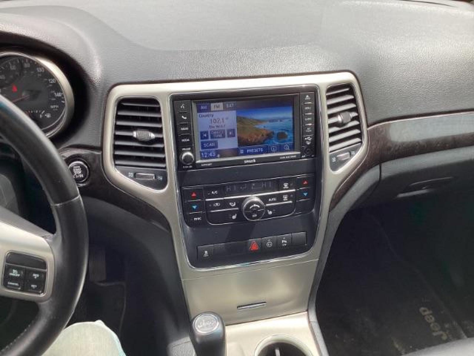 2012 Mineral Gray Metallic Jeep Grand Cherokee Laredo 4WD (1C4RJFAG3CC) with an 3.6L V6 DOHC 24V engine, 5-Speed Automatic transmission, located at 1235 N Woodruff Ave., Idaho Falls, 83401, (208) 523-1053, 43.507172, -112.000488 - Photo #10
