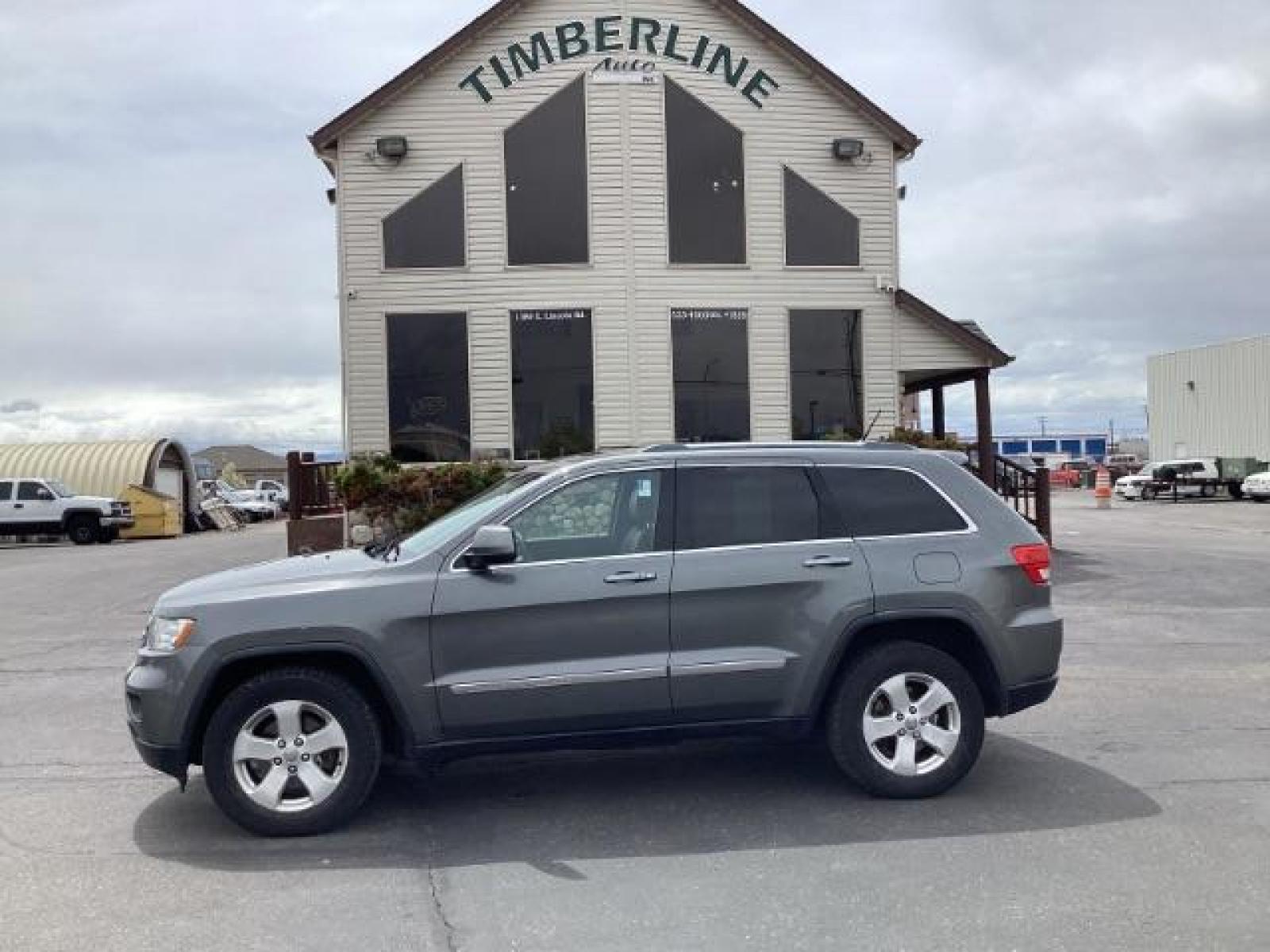 2012 Mineral Gray Metallic Jeep Grand Cherokee Laredo 4WD (1C4RJFAG3CC) with an 3.6L V6 DOHC 24V engine, 5-Speed Automatic transmission, located at 1235 N Woodruff Ave., Idaho Falls, 83401, (208) 523-1053, 43.507172, -112.000488 - Photo #1