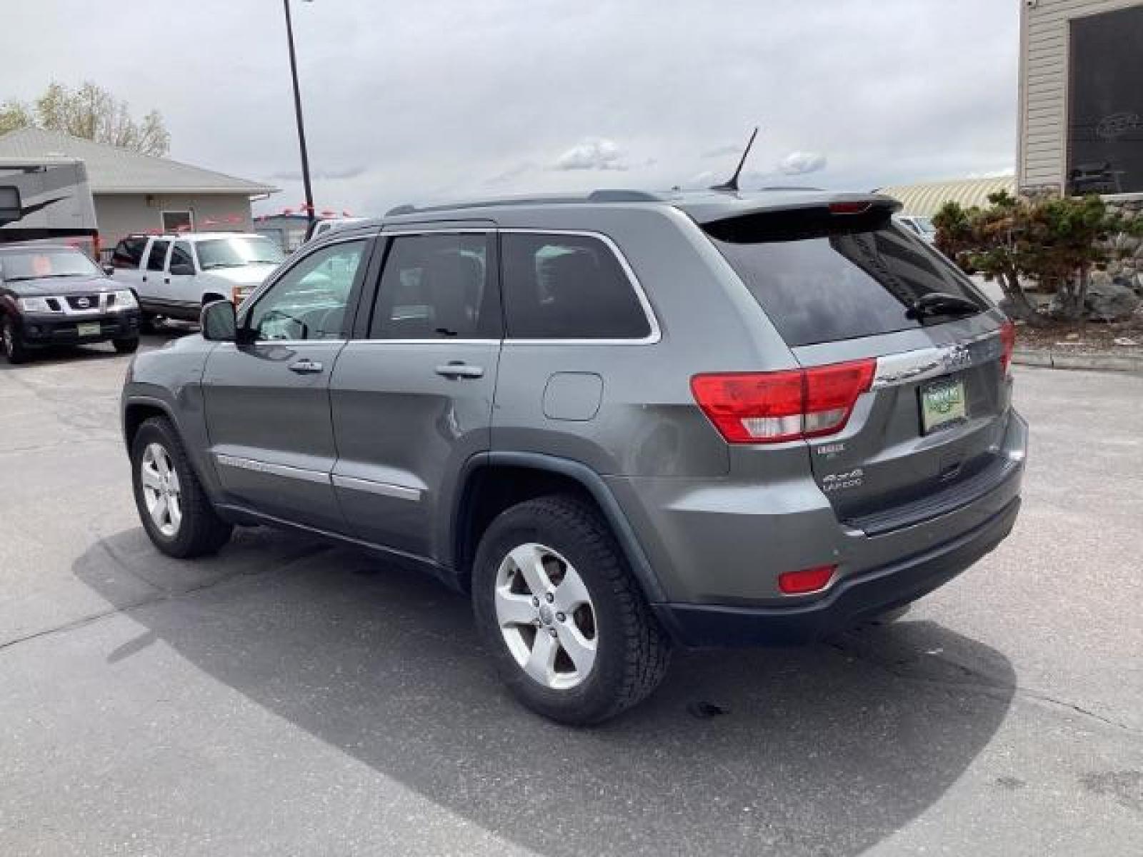 2012 Mineral Gray Metallic Jeep Grand Cherokee Laredo 4WD (1C4RJFAG3CC) with an 3.6L V6 DOHC 24V engine, 5-Speed Automatic transmission, located at 1235 N Woodruff Ave., Idaho Falls, 83401, (208) 523-1053, 43.507172, -112.000488 - The 2012 Jeep Grand Cherokee Laredo 4x4 offers a range of features suitable for both on-road comfort and off-road capability. Here are some of the key features you might find on this model: Engine Options: The Grand Cherokee Laredo might come with a choice of engines, including a V6 or V8 engine. T - Photo #2