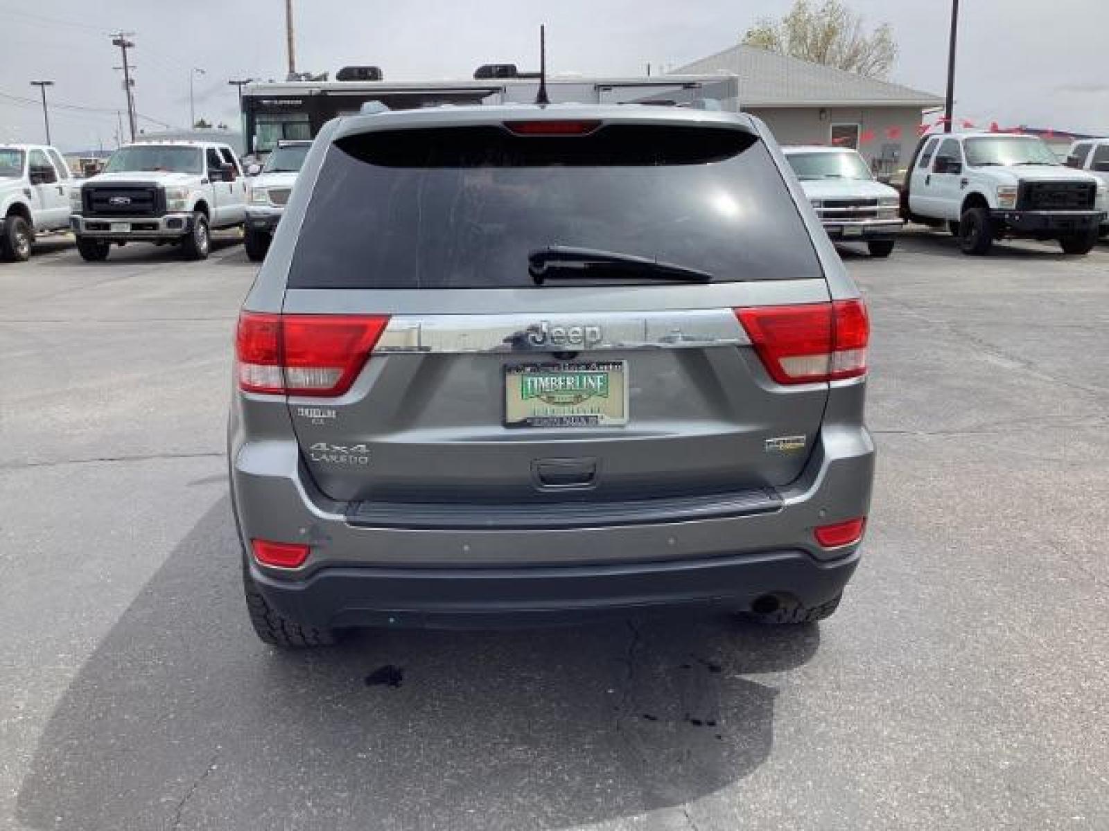 2012 Mineral Gray Metallic Jeep Grand Cherokee Laredo 4WD (1C4RJFAG3CC) with an 3.6L V6 DOHC 24V engine, 5-Speed Automatic transmission, located at 1235 N Woodruff Ave., Idaho Falls, 83401, (208) 523-1053, 43.507172, -112.000488 - The 2012 Jeep Grand Cherokee Laredo 4x4 offers a range of features suitable for both on-road comfort and off-road capability. Here are some of the key features you might find on this model: Engine Options: The Grand Cherokee Laredo might come with a choice of engines, including a V6 or V8 engine. T - Photo #3
