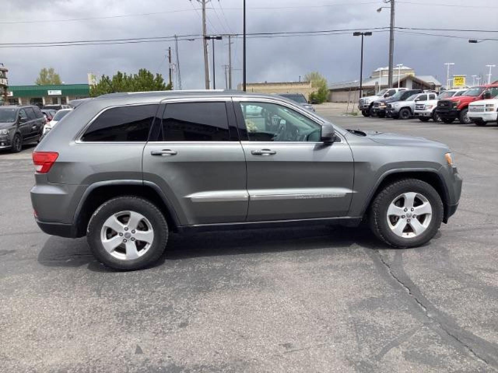 2012 Mineral Gray Metallic Jeep Grand Cherokee Laredo 4WD (1C4RJFAG3CC) with an 3.6L V6 DOHC 24V engine, 5-Speed Automatic transmission, located at 1235 N Woodruff Ave., Idaho Falls, 83401, (208) 523-1053, 43.507172, -112.000488 - The 2012 Jeep Grand Cherokee Laredo 4x4 offers a range of features suitable for both on-road comfort and off-road capability. Here are some of the key features you might find on this model: Engine Options: The Grand Cherokee Laredo might come with a choice of engines, including a V6 or V8 engine. T - Photo #5