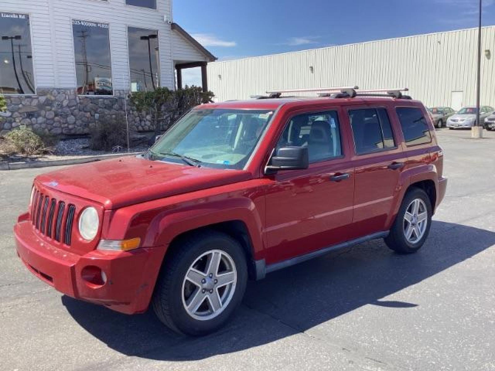 2008 Inferno Red Crystal Pearl /Dark Slate Gray Cloth Interior Jeep Patriot Sport 4WD (1J8FF28W28D) with an 2.4L L4 DOHC 16V engine, located at 1235 N Woodruff Ave., Idaho Falls, 83401, (208) 523-1053, 43.507172, -112.000488 - The 2008 Jeep Patriot Sport offers a combination of rugged styling, practicality, and capability. Here are some key features you can typically find in the 2008 Jeep Patriot Sport: Engine Options: The Patriot Sport typically comes with a choice of two engine options: 2.0-liter four-cylinder engine: - Photo #0