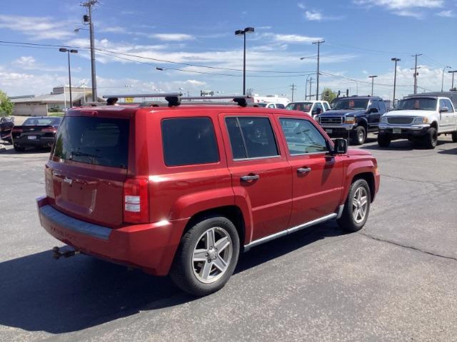2008 Inferno Red Crystal Pearl /Dark Slate Gray Cloth Interior Jeep Patriot Sport 4WD (1J8FF28W28D) with an 2.4L L4 DOHC 16V engine, located at 1235 N Woodruff Ave., Idaho Falls, 83401, (208) 523-1053, 43.507172, -112.000488 - The 2008 Jeep Patriot Sport offers a combination of rugged styling, practicality, and capability. Here are some key features you can typically find in the 2008 Jeep Patriot Sport: Engine Options: The Patriot Sport typically comes with a choice of two engine options: 2.0-liter four-cylinder engine: - Photo #4