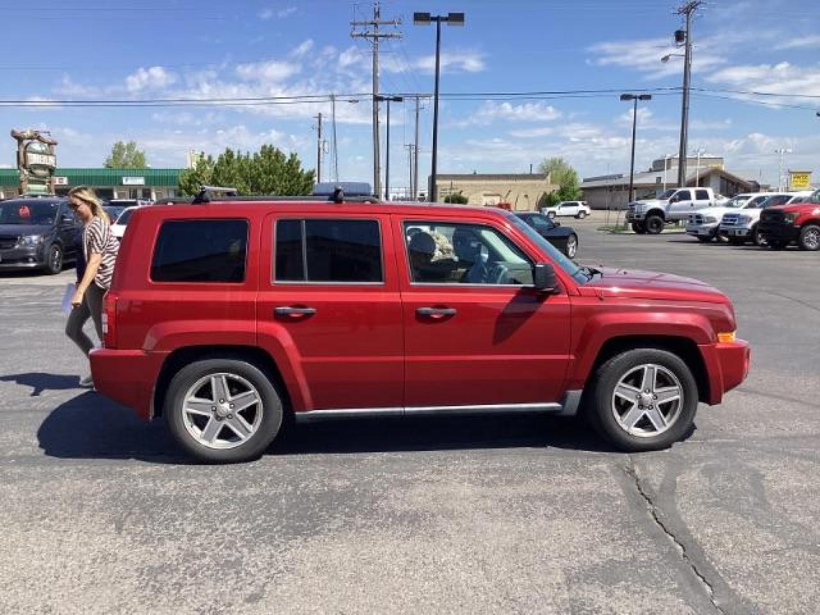 2008 Inferno Red Crystal Pearl /Dark Slate Gray Cloth Interior Jeep Patriot Sport 4WD (1J8FF28W28D) with an 2.4L L4 DOHC 16V engine, located at 1235 N Woodruff Ave., Idaho Falls, 83401, (208) 523-1053, 43.507172, -112.000488 - The 2008 Jeep Patriot Sport offers a combination of rugged styling, practicality, and capability. Here are some key features you can typically find in the 2008 Jeep Patriot Sport: Engine Options: The Patriot Sport typically comes with a choice of two engine options: 2.0-liter four-cylinder engine: - Photo #5
