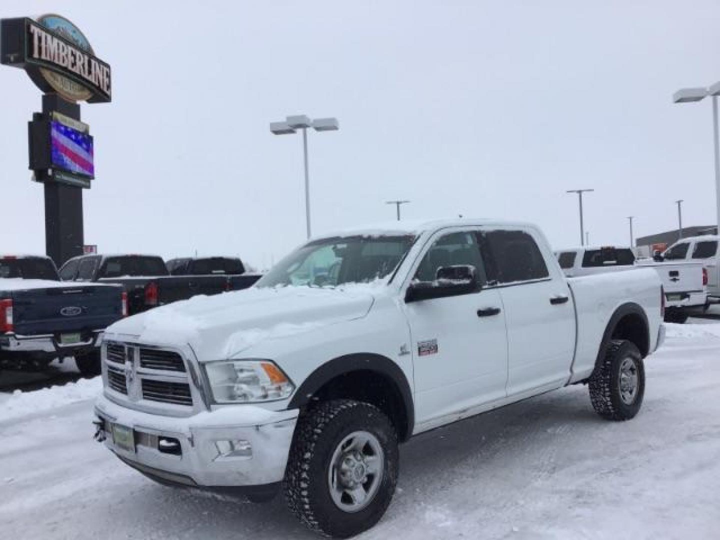 2012 Bright White /Dark Slate/Medium Graystone Cloth Interior RAM 3500 SLT Crew Cab SWB 4WD (3C63D3DLXCG) with an 6.7L L6 OHV 24V TURBO DIESEL engine, 6-Speed Automatic transmission, located at 1235 N Woodruff Ave., Idaho Falls, 83401, (208) 523-1053, 43.507172, -112.000488 - This 2012 Ram 3500 4x4 SLT, has the 6.7L diesel motor. It has 153,000 miles. Comes with cloth seats, AM/FM blue tooth stereo, power locks and windows. At Timberline Auto it is always easy to find a great deal on your next vehicle! Our experienced sales staff can help find the right vehicle that will - Photo#0