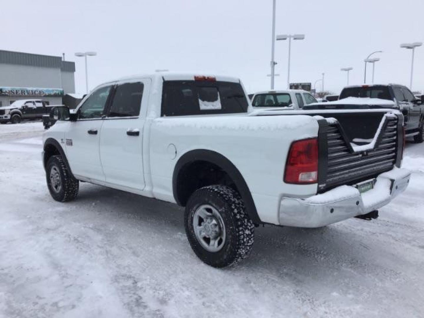 2012 Bright White /Dark Slate/Medium Graystone Cloth Interior RAM 3500 SLT Crew Cab SWB 4WD (3C63D3DLXCG) with an 6.7L L6 OHV 24V TURBO DIESEL engine, 6-Speed Automatic transmission, located at 1235 N Woodruff Ave., Idaho Falls, 83401, (208) 523-1053, 43.507172, -112.000488 - This 2012 Ram 3500 4x4 SLT, has the 6.7L diesel motor. It has 153,000 miles. Comes with cloth seats, AM/FM blue tooth stereo, power locks and windows. At Timberline Auto it is always easy to find a great deal on your next vehicle! Our experienced sales staff can help find the right vehicle that will - Photo#2