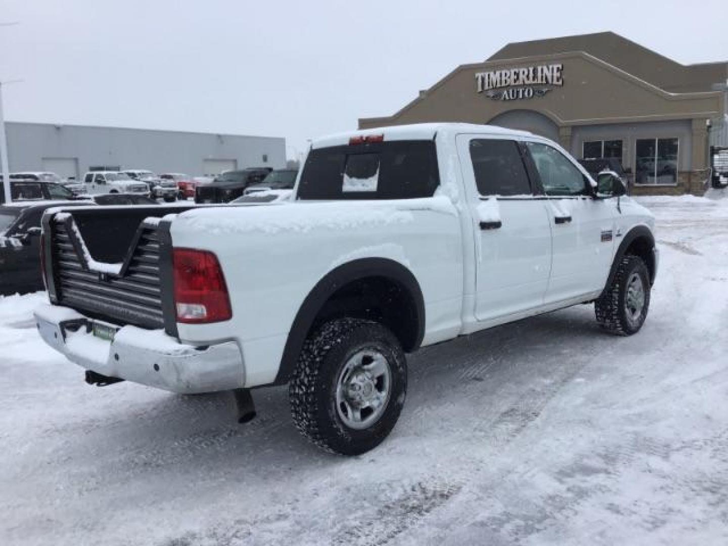 2012 Bright White /Dark Slate/Medium Graystone Cloth Interior RAM 3500 SLT Crew Cab SWB 4WD (3C63D3DLXCG) with an 6.7L L6 OHV 24V TURBO DIESEL engine, 6-Speed Automatic transmission, located at 1235 N Woodruff Ave., Idaho Falls, 83401, (208) 523-1053, 43.507172, -112.000488 - This 2012 Ram 3500 4x4 SLT, has the 6.7L diesel motor. It has 153,000 miles. Comes with cloth seats, AM/FM blue tooth stereo, power locks and windows. At Timberline Auto it is always easy to find a great deal on your next vehicle! Our experienced sales staff can help find the right vehicle that will - Photo#4