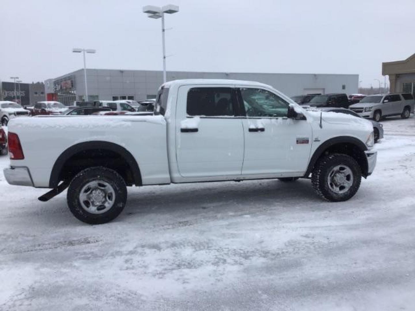 2012 Bright White /Dark Slate/Medium Graystone Cloth Interior RAM 3500 SLT Crew Cab SWB 4WD (3C63D3DLXCG) with an 6.7L L6 OHV 24V TURBO DIESEL engine, 6-Speed Automatic transmission, located at 1235 N Woodruff Ave., Idaho Falls, 83401, (208) 523-1053, 43.507172, -112.000488 - This 2012 Ram 3500 4x4 SLT, has the 6.7L diesel motor. It has 153,000 miles. Comes with cloth seats, AM/FM blue tooth stereo, power locks and windows. At Timberline Auto it is always easy to find a great deal on your next vehicle! Our experienced sales staff can help find the right vehicle that will - Photo#5