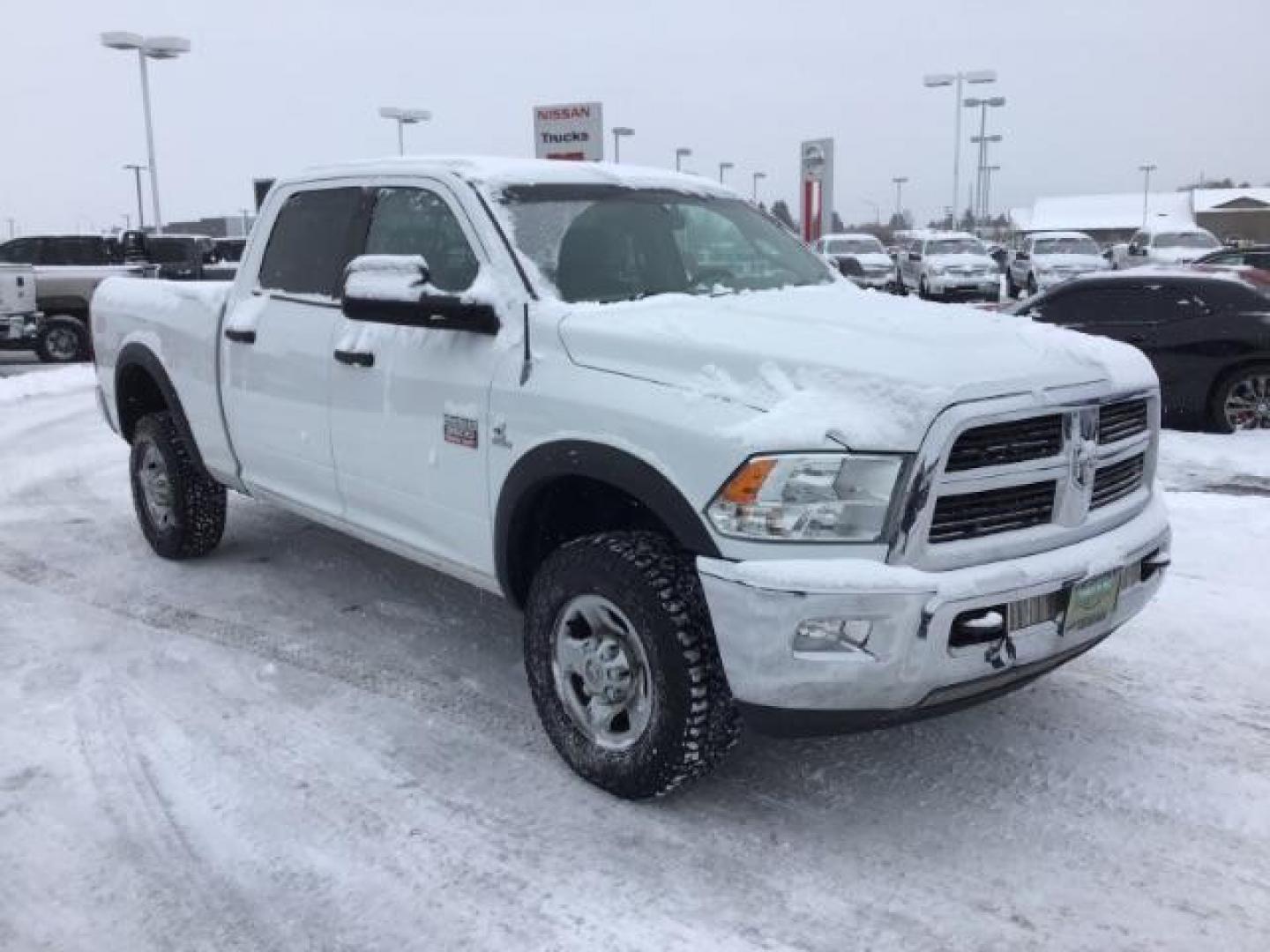 2012 Bright White /Dark Slate/Medium Graystone Cloth Interior RAM 3500 SLT Crew Cab SWB 4WD (3C63D3DLXCG) with an 6.7L L6 OHV 24V TURBO DIESEL engine, 6-Speed Automatic transmission, located at 1235 N Woodruff Ave., Idaho Falls, 83401, (208) 523-1053, 43.507172, -112.000488 - This 2012 Ram 3500 4x4 SLT, has the 6.7L diesel motor. It has 153,000 miles. Comes with cloth seats, AM/FM blue tooth stereo, power locks and windows. At Timberline Auto it is always easy to find a great deal on your next vehicle! Our experienced sales staff can help find the right vehicle that will - Photo#6