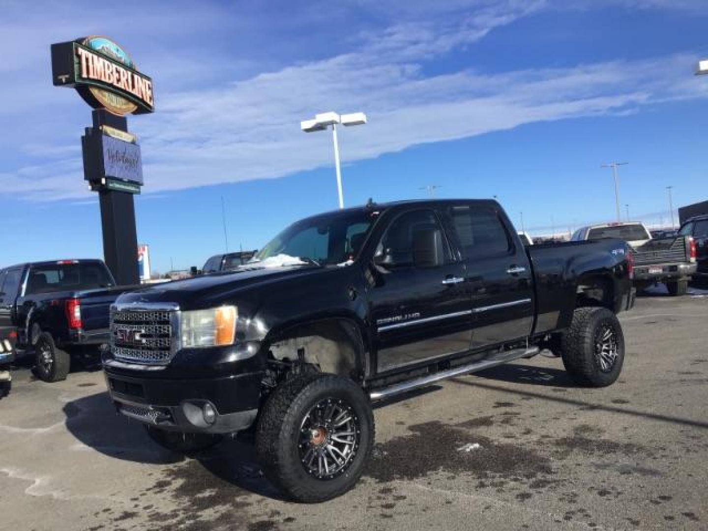 2012 Onyx Black /Ebony Leather Interior GMC Sierra 2500HD Denali Crew Cab 4WD (1GT125E8XCF) with an 6.6L V8 OHV 32V TURBO DIESEL engine, 6-Speed Automatic transmission, located at 1235 N Woodruff Ave., Idaho Falls, 83401, (208) 523-1053, 43.507172, -112.000488 - This 2012 GMC Denali 2500 4x4, has the 6.6L Duramax motor. It has 115,000 miles. It comes with Spray in Bed liner, heated seats, leather seats, sunroof, and Bose premium sound. At Timberline Auto it is always easy to find a great deal on your next vehicle! Our experienced sales staff can help find t - Photo#0