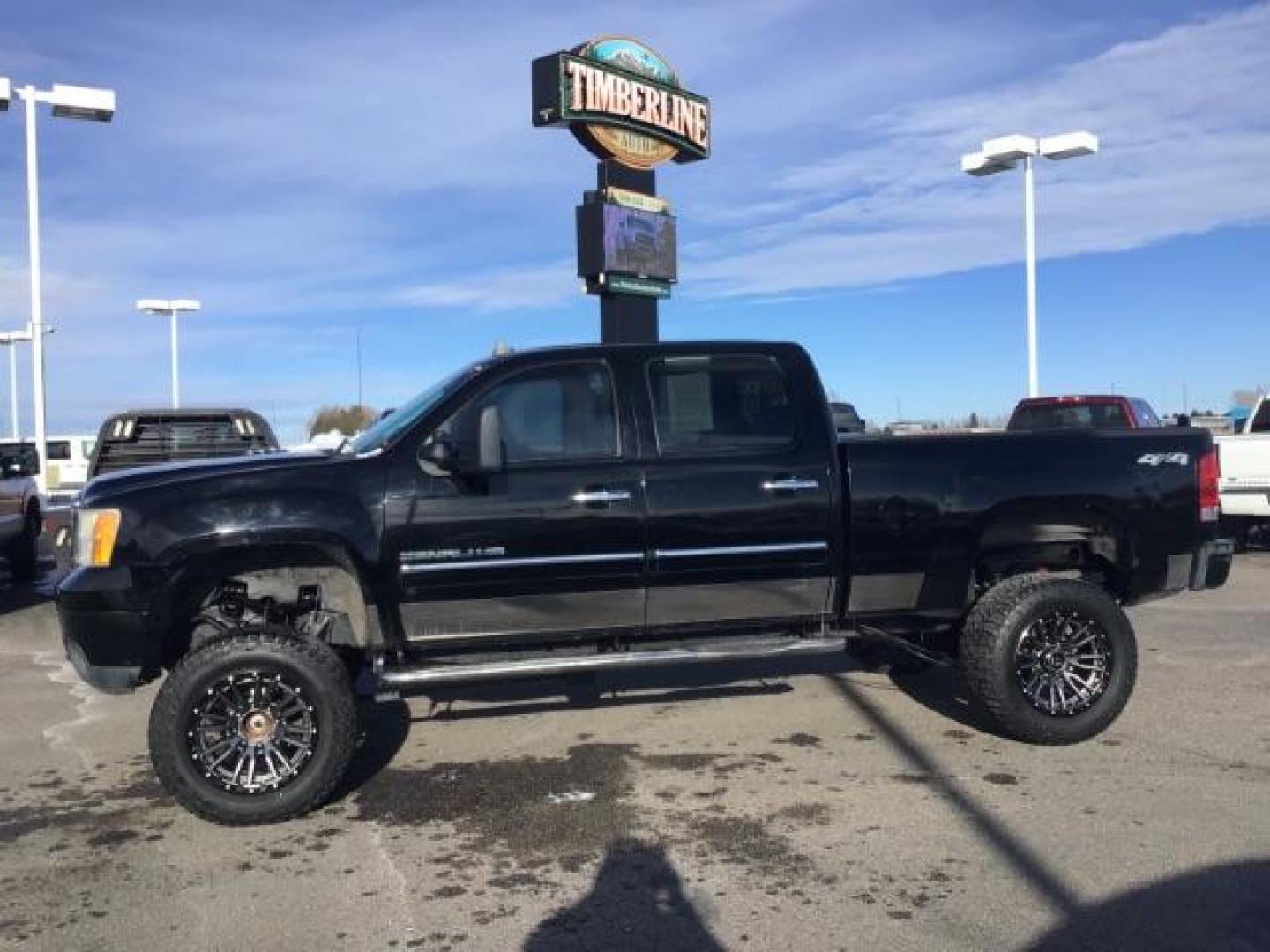 2012 Onyx Black /Ebony Leather Interior GMC Sierra 2500HD Denali Crew Cab 4WD (1GT125E8XCF) with an 6.6L V8 OHV 32V TURBO DIESEL engine, 6-Speed Automatic transmission, located at 1235 N Woodruff Ave., Idaho Falls, 83401, (208) 523-1053, 43.507172, -112.000488 - This 2012 GMC Denali 2500 4x4, has the 6.6L Duramax motor. It has 115,000 miles. It comes with Spray in Bed liner, heated seats, leather seats, sunroof, and Bose premium sound. At Timberline Auto it is always easy to find a great deal on your next vehicle! Our experienced sales staff can help find t - Photo#1