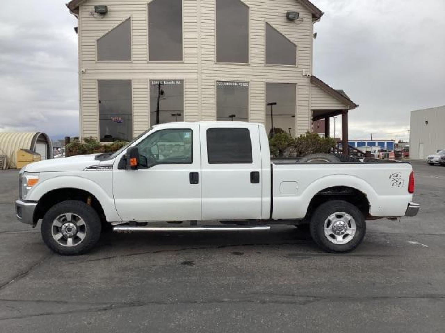 2014 Oxford White Ford F-350 SD XLT Crew Cab 4WD (1FT8W3B69EE) with an 6.2L V8 OHV 16V engine, 6-Speed Automatic transmission, located at 1235 N Woodruff Ave., Idaho Falls, 83401, (208) 523-1053, 43.507172, -112.000488 - Photo#2